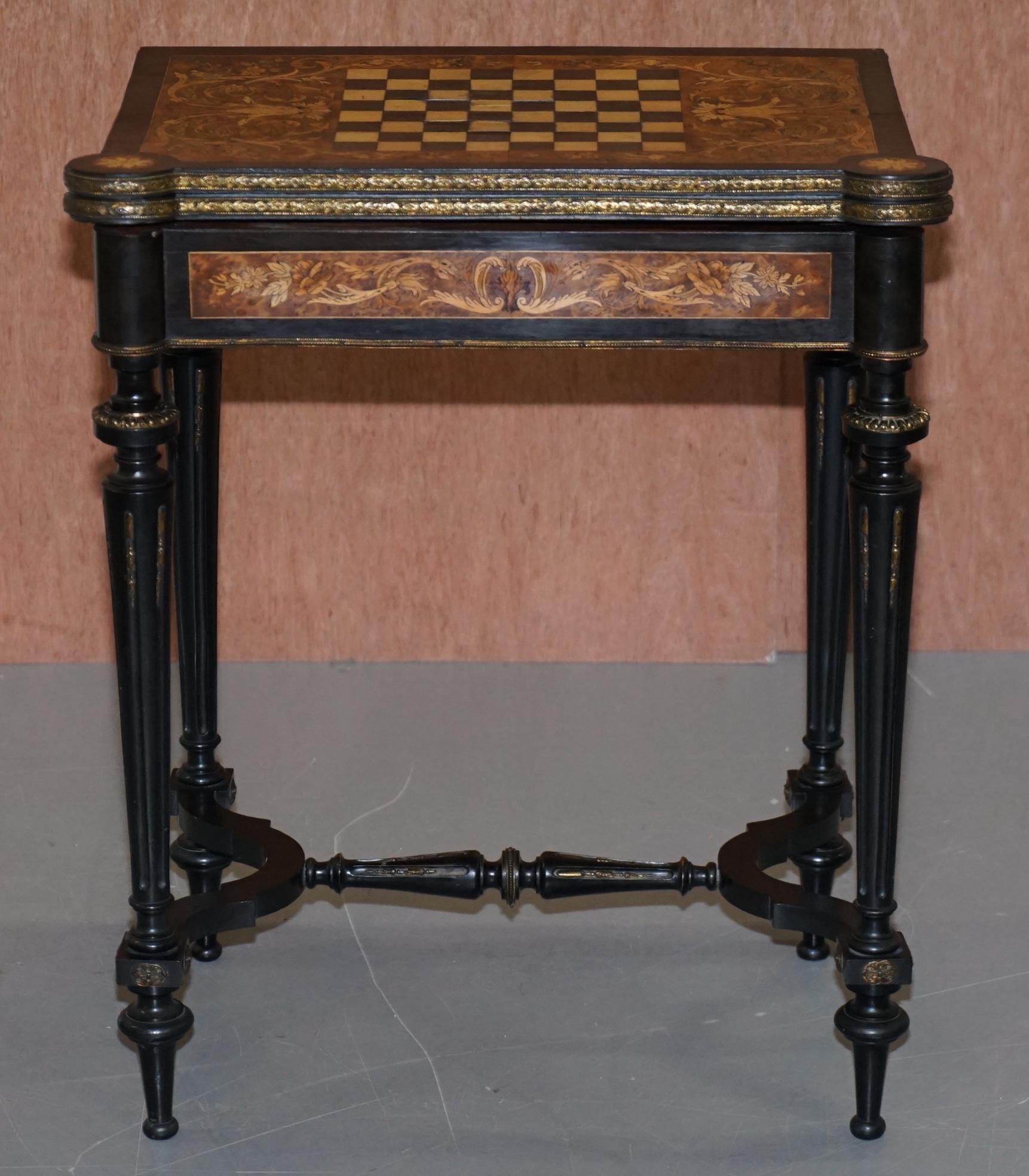 We are delighted to offer this lovely Aesthetic movement ebonised, marquetry inlaid Victorian Chess table with fold over card playing board finished with Ormolu mounts

A very good looking example of this highly collectable Aesthetic movement