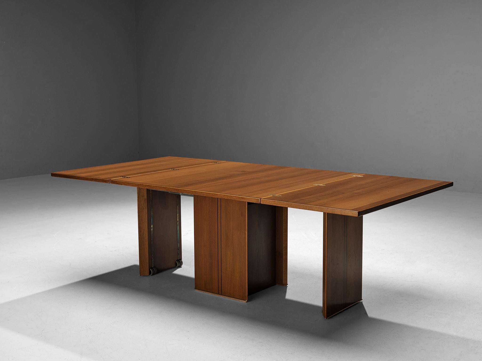 Afra & Tobia Scarpa for Maxalto, dining table model ‘Artona’, walnut, brass, leather, Italy, 1975/1979

This table was designed by Afra & Tobia Scarpa within the ‘Artona’ line for Maxalto. This particular model is rare as it features an intricate