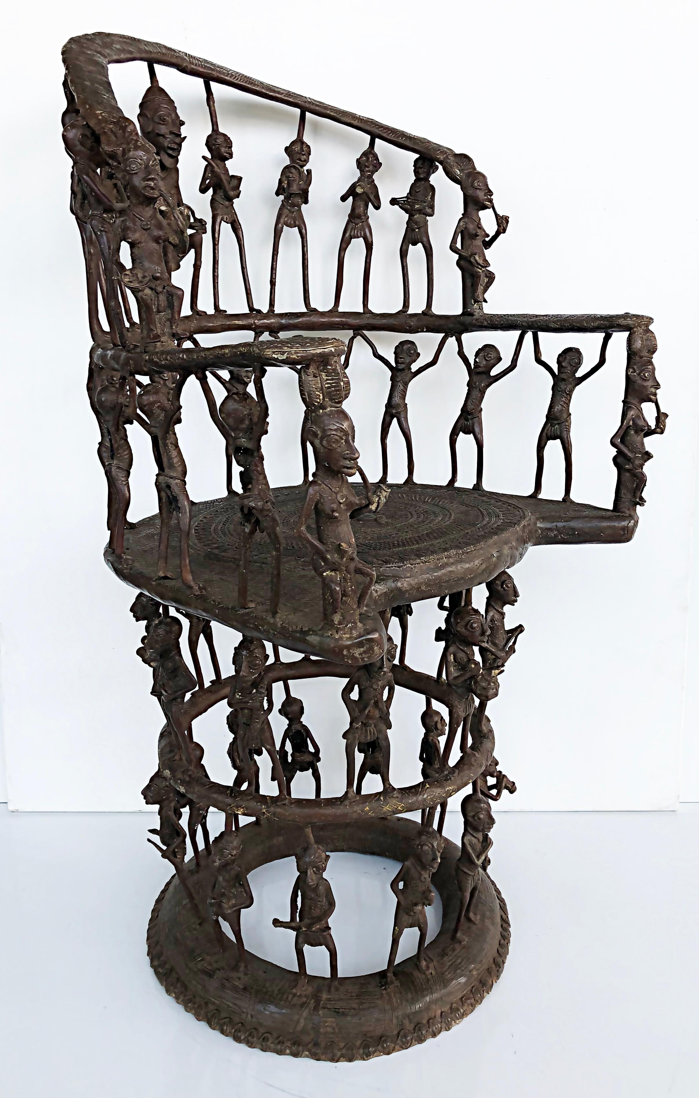 Rare African Cameroon Bronze Figurative Throne Chair, 20th Century

Offered for sale is a large rare African bronze figurative throne chair from Cameroon. The chair is a 20th-century creation after the tribal style. The chair has numerous figures