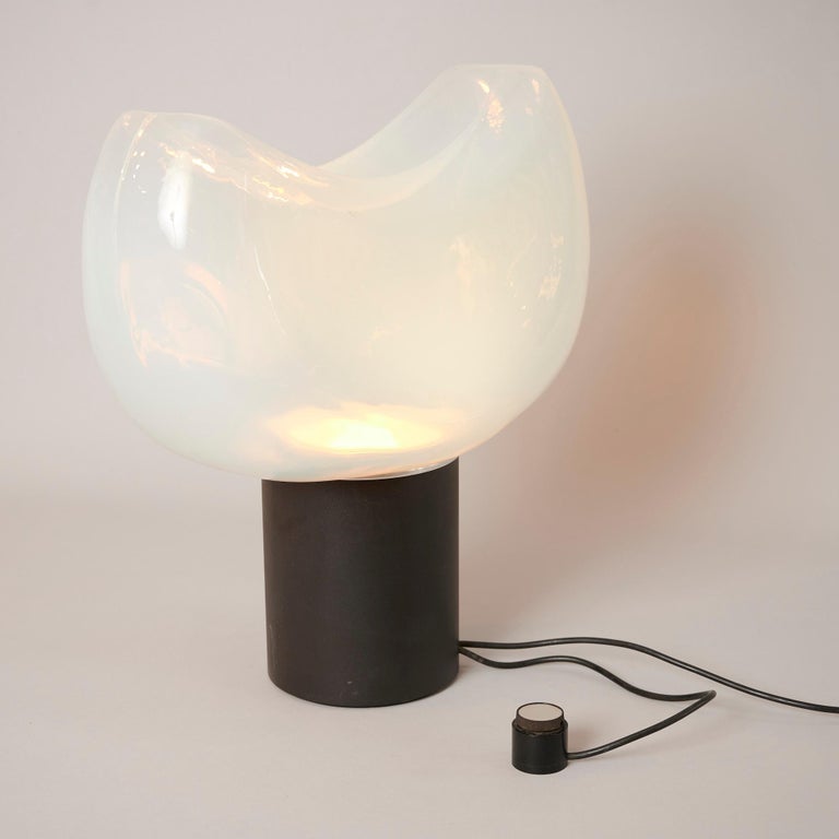 Large sculptural table light. Opalescent glass on heavy metal base with dimmer

Lovely light from the glass of this lamp

Leucos label present.