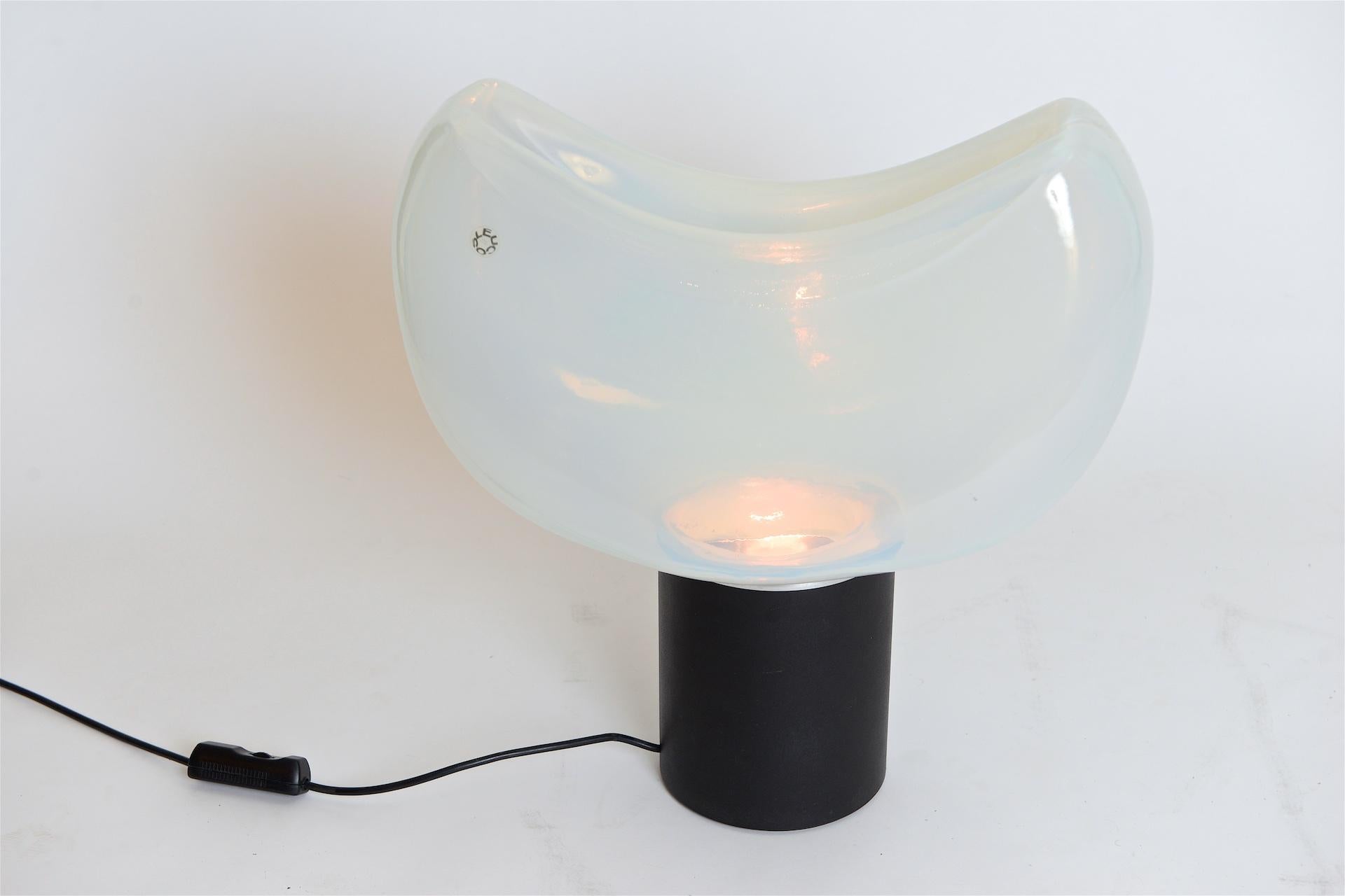 Large sculptural table light. Opalescent glass on heavy metal base with dimmer

Lovely light from the glass of this lamp

Leucos label present.