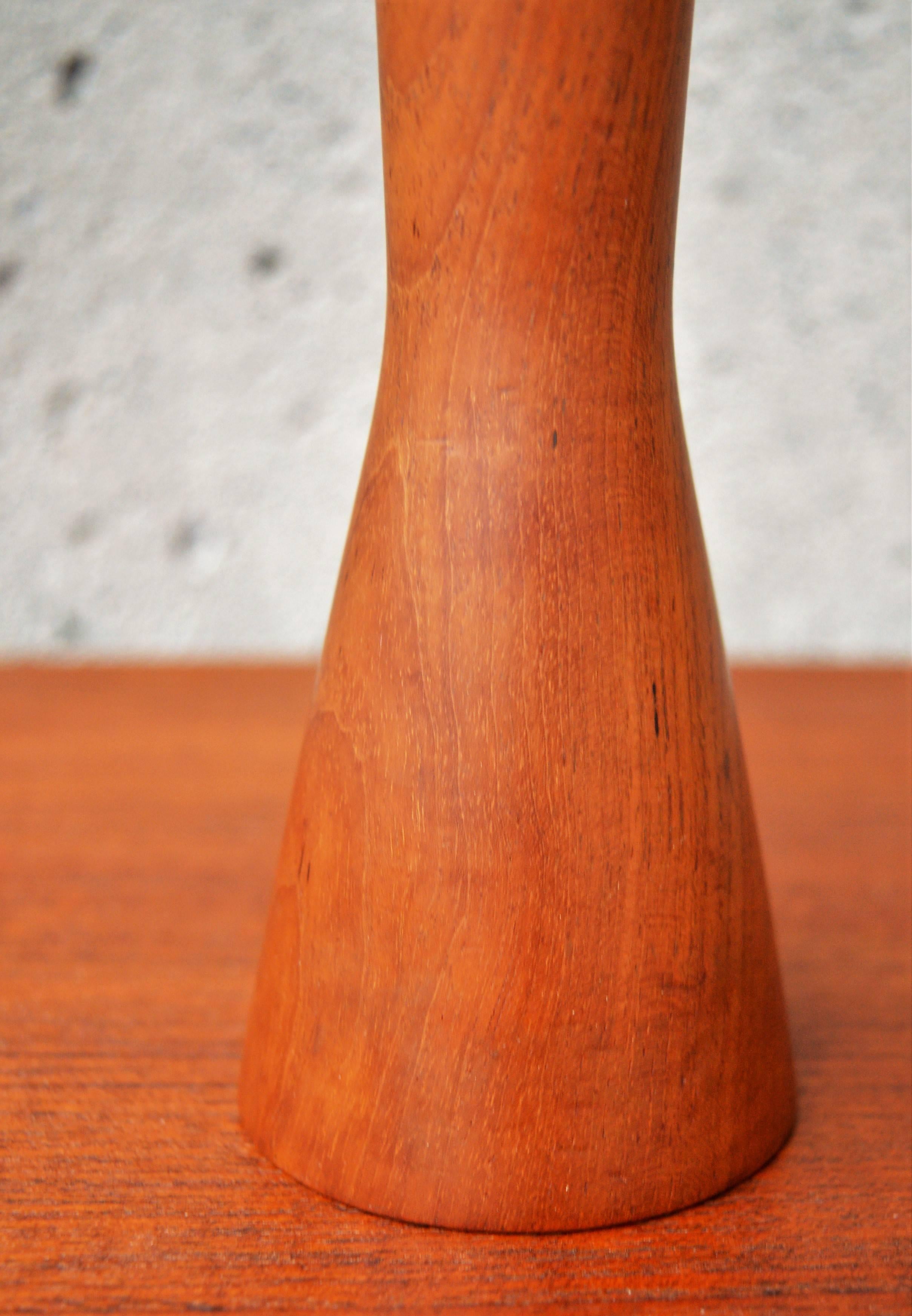 This lovely and rare peppermill was designed by Alf Hansen for P. Broste, Denmark. It is made from an hourglass shaped teak base with a zebrawood top. The steel grinding mechanism was made if France. Perfect as a centerpiece on the dinner table and