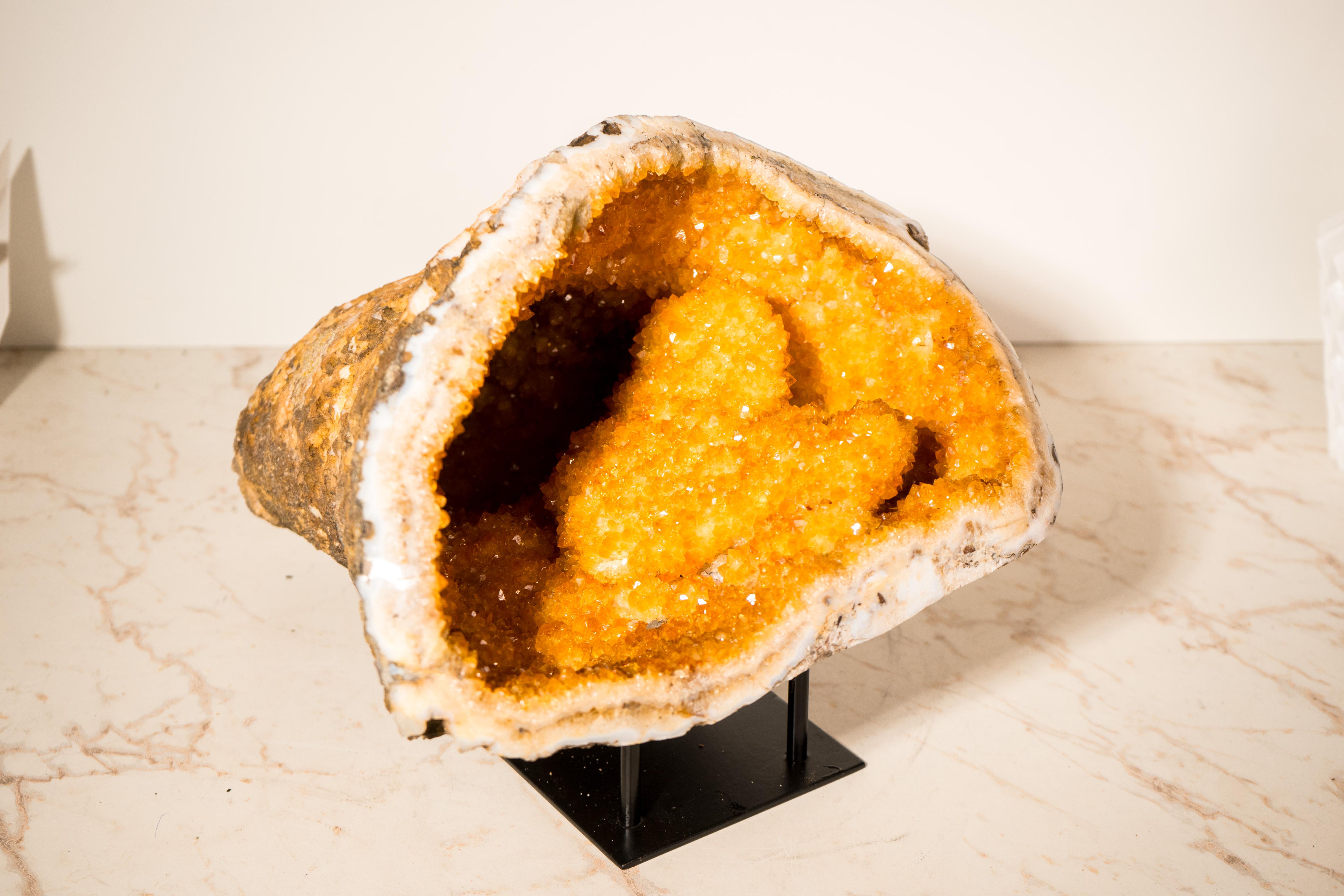 A Rare All-Natural Sparkly Orange Citrine Cave with Stalactite Flowers: A Feng Shui Powerhouse

▫️ Description

With rare characteristics and beauty, this all-natural citrine geode cave is a highly energetic specimen. Its interior is fully covered