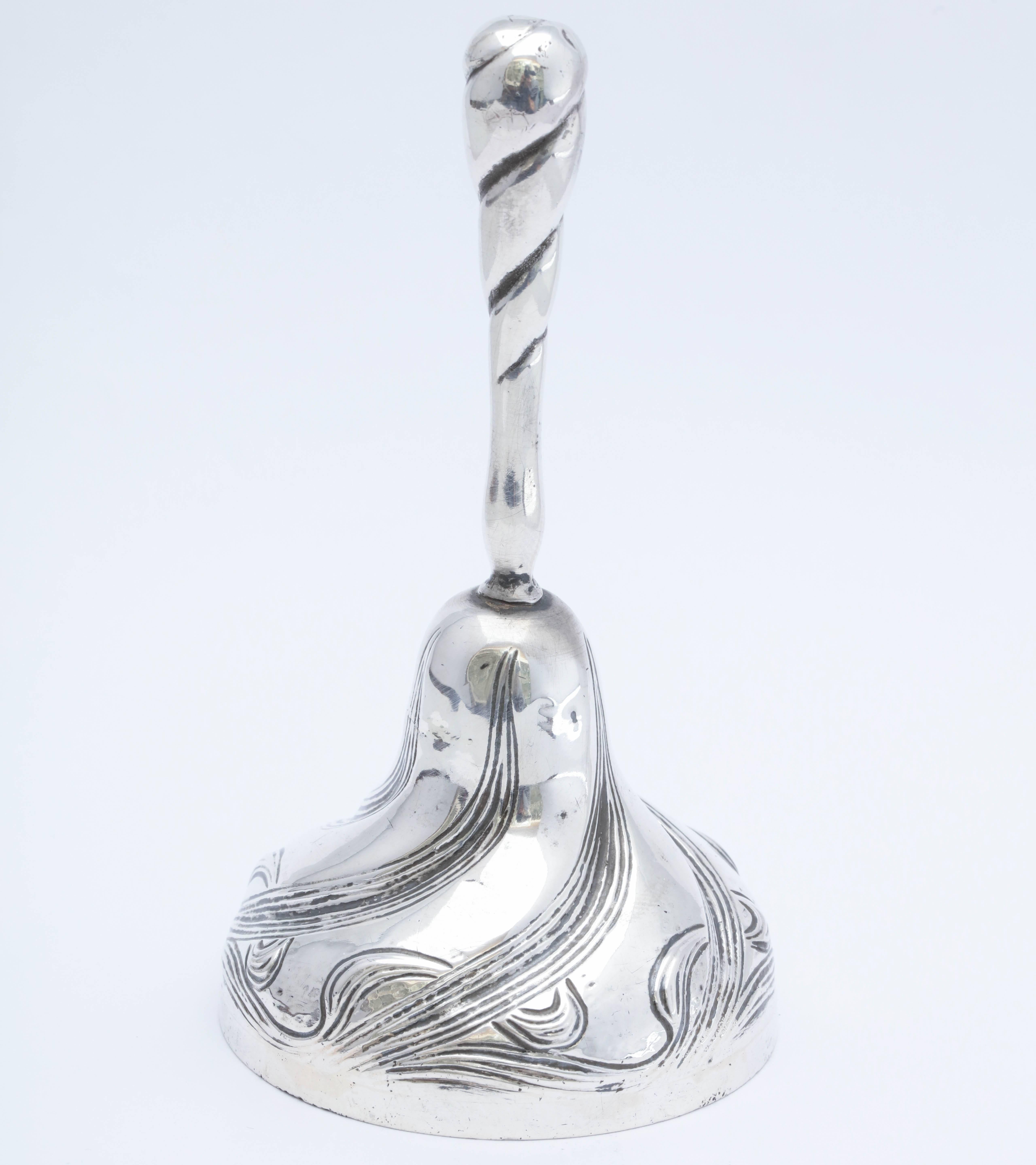 Rare, Art Nouveau, all sterling silver (including clapper) bell, William B. Kerr and Co., New Jersey, Ca. 1895-1908. Decorated with graceful flowers stems that whip around the bell. Measures 5 inches high (to top of handle) x 2 1/2 inches in