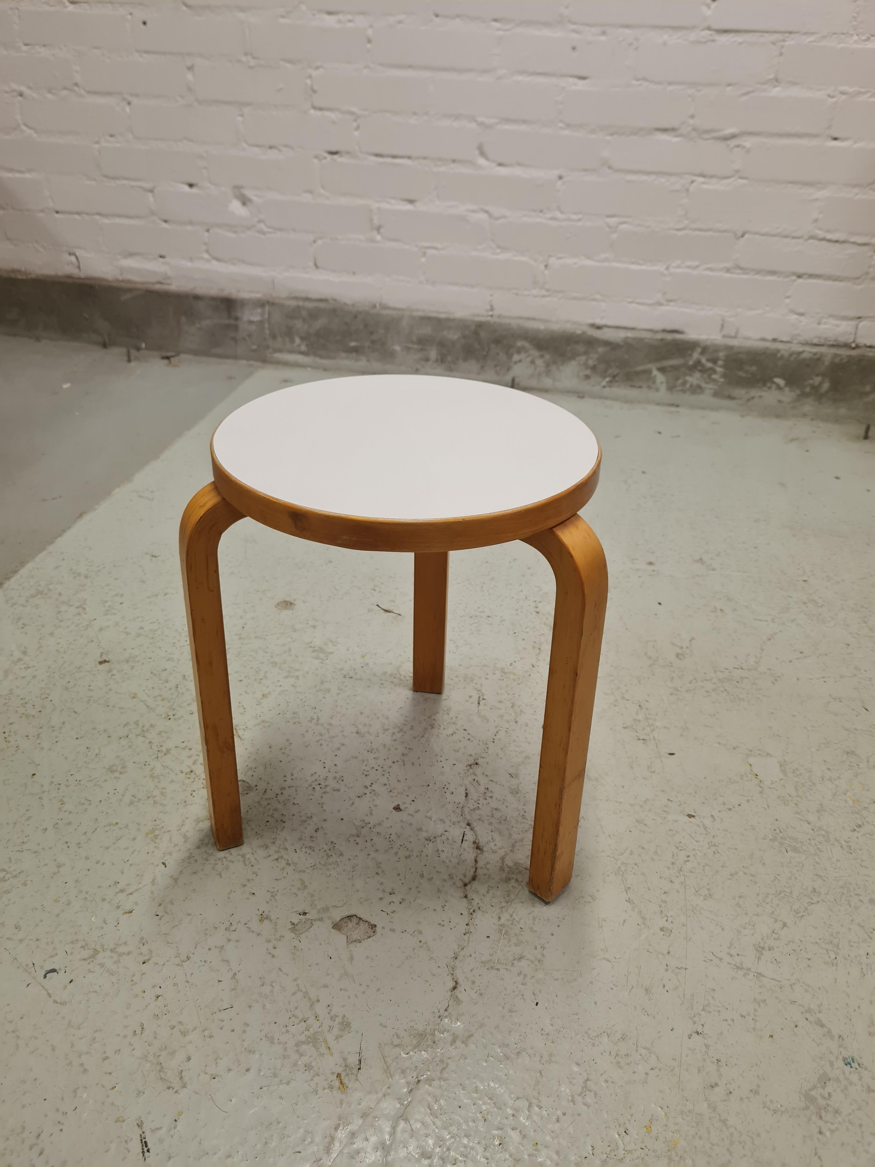 A beautiful and rarely seen example of the iconic Aalto stools with the original formica seating.
These 3 legged stools have long been our customers favorites, especially in rare colors and patina. 
This example in white fits these catagories.