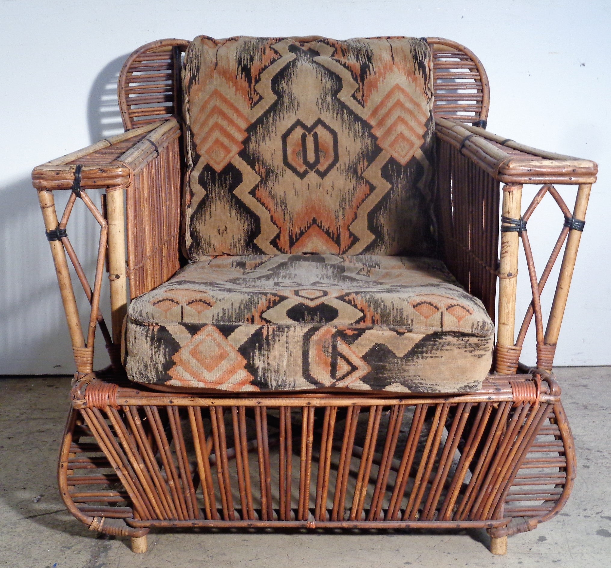 American Art Deco period large scale natural stick wicker rattan lounge armchair in nicely aged original old color. Exceptionally great looking chair. Very rare design. Circa 1930. Measurements - 31 1/2