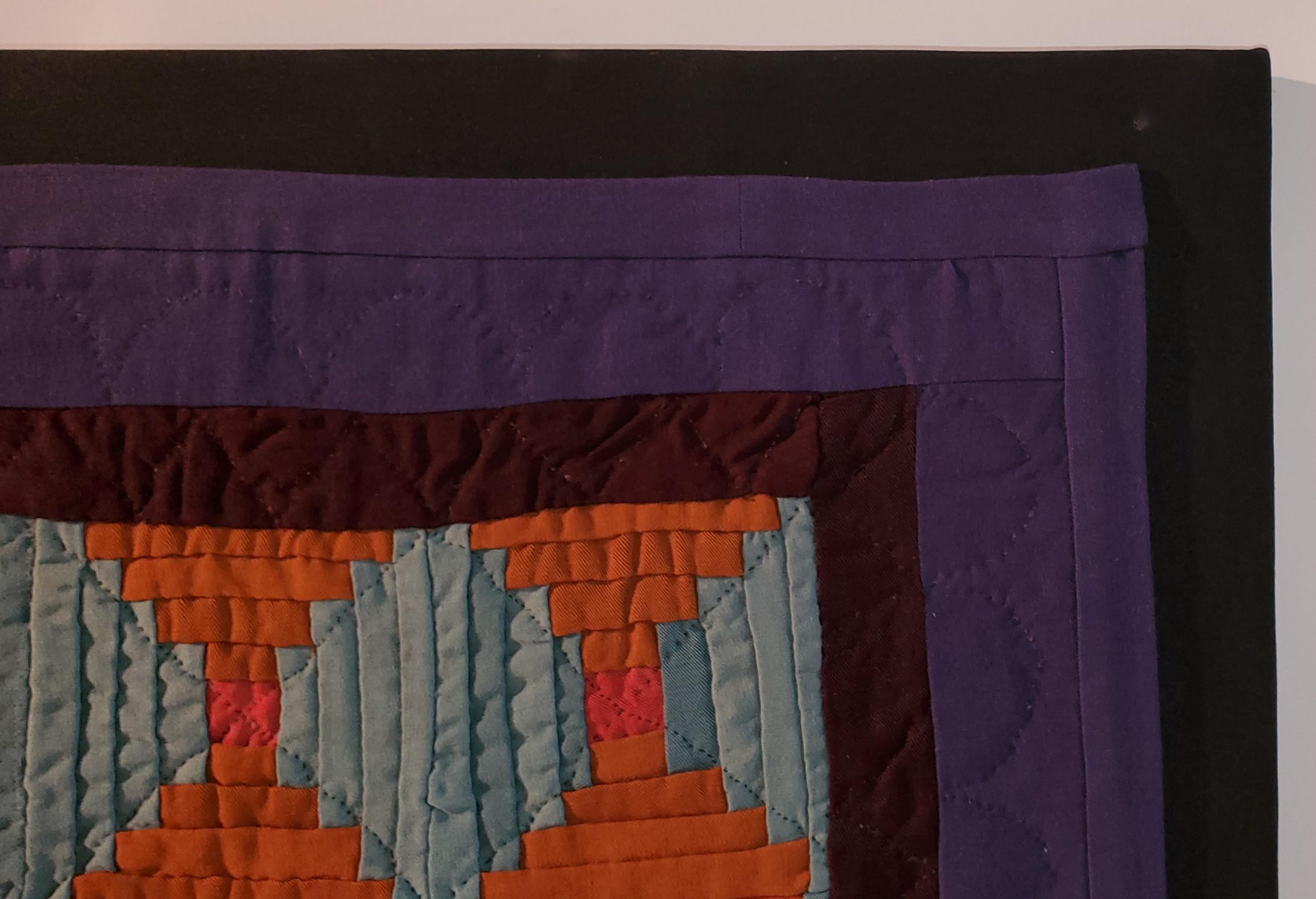 This super rare Amish wool doll quilt is from Lancaster County, Pennsylvania and is in amazing condition and is mounted on frame. The log cabin pattern is very unusual and in orange & light blue. The inner border is burgundy and the border is in