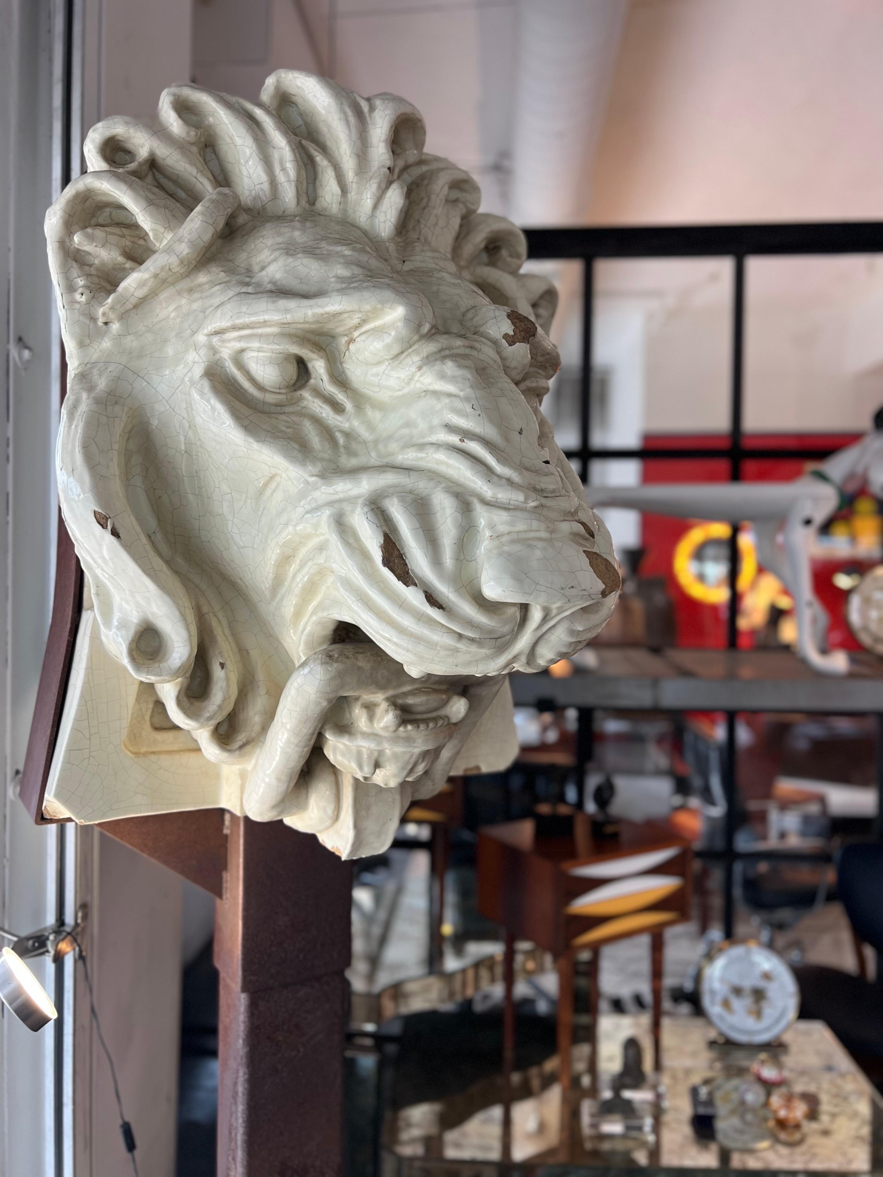 Very rare ancienne architectural lion head, Downtown Los Angeles, circa 1885. The lion head is made with a mix of stone and glazed porcelain, mounted on a steel stand. Can be purchased with or without the metal stand. Can be used indoors or