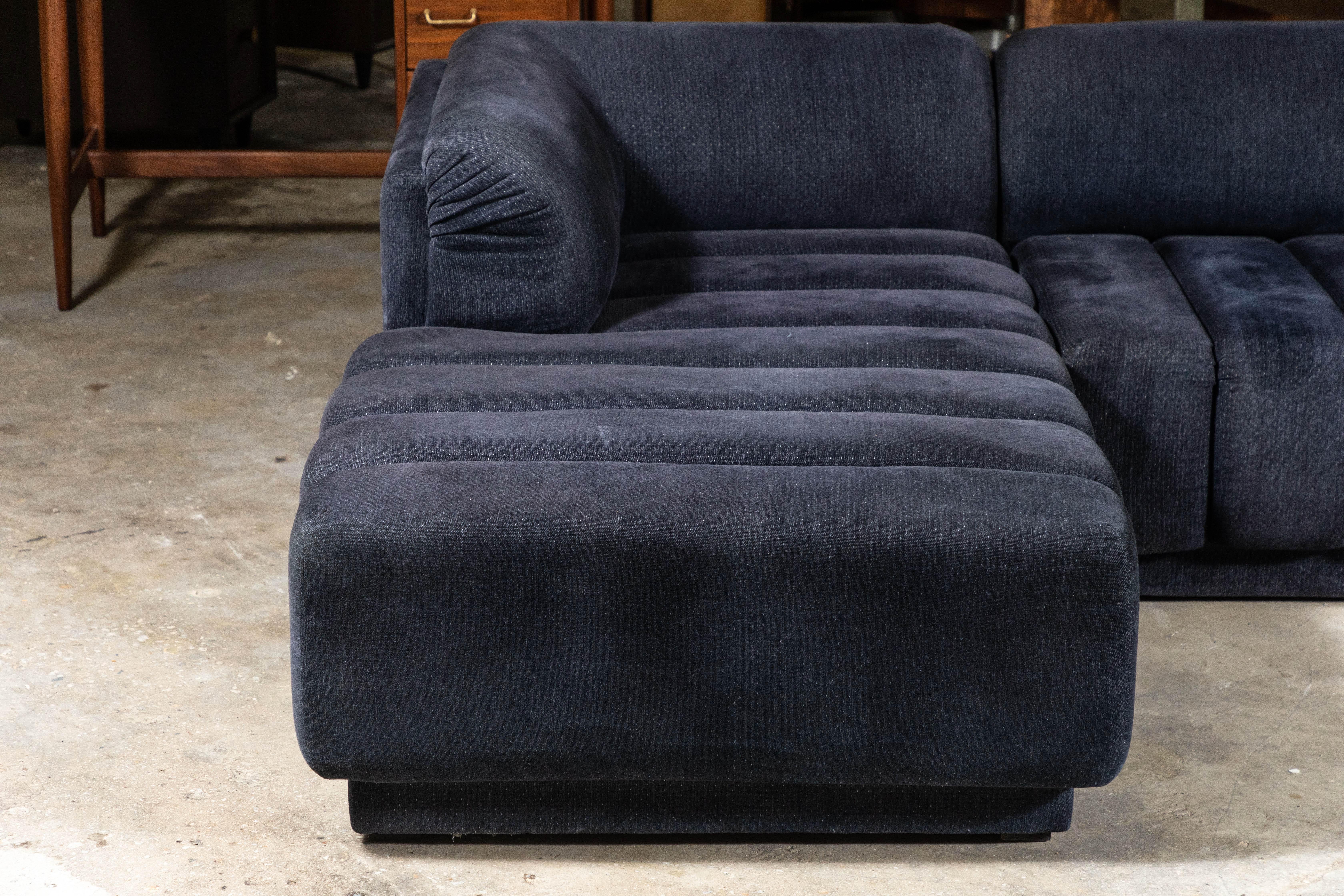 Gorgeous 2-piece sectional sofa by Directional. Designer unknown, but the names Paul Evans, Vladimir Kagan, Milo Baughman, Paul McCobb all designed for Directional. An amazing design regardless. Dark blue grey velvet like soft fabric. This is a rare