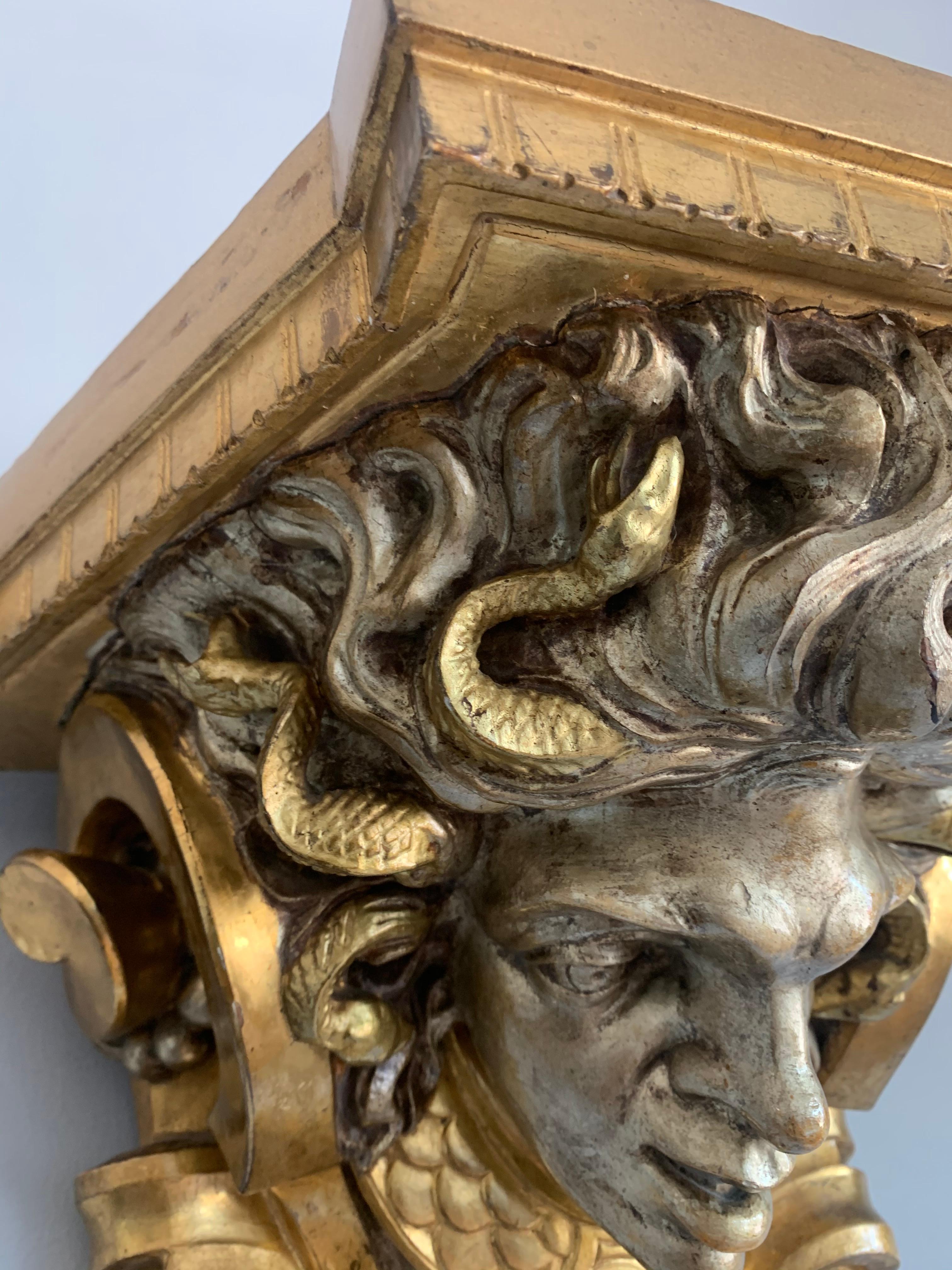 Rare and Antique Pair of Carved Gilt and Silvered Medusa Sculpture Wall Brackets In Good Condition In Lisse, NL