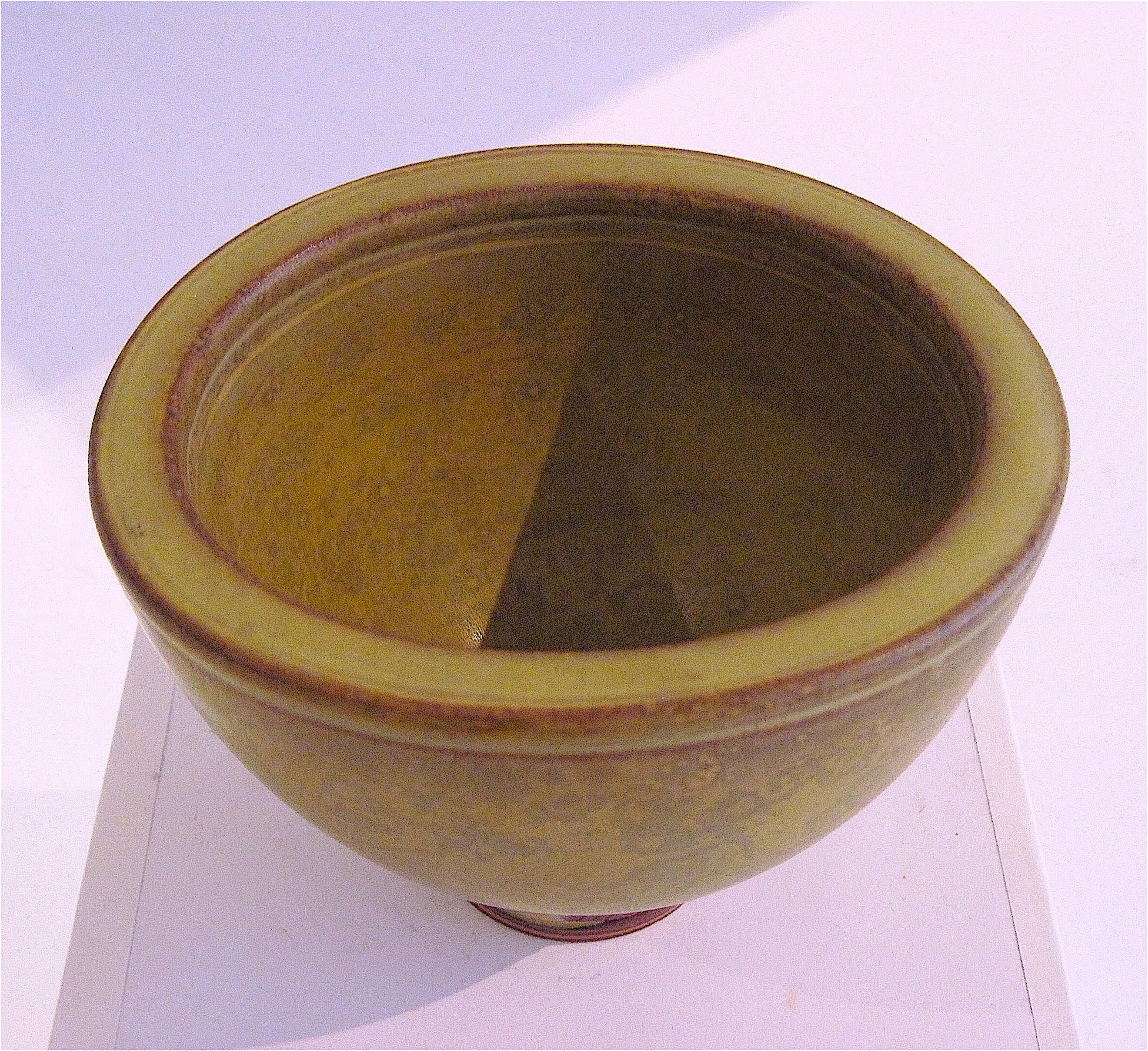 Excellent hand thrown Kage Farsta stoneware bowl with interesting and nicely drippy matte finish yellow/ochre glaze. Hand signed and stamped, as shown. The world renown Wilhelm Kage (1889 - 1960) was a Swedish artist, painter and ceramist. He was