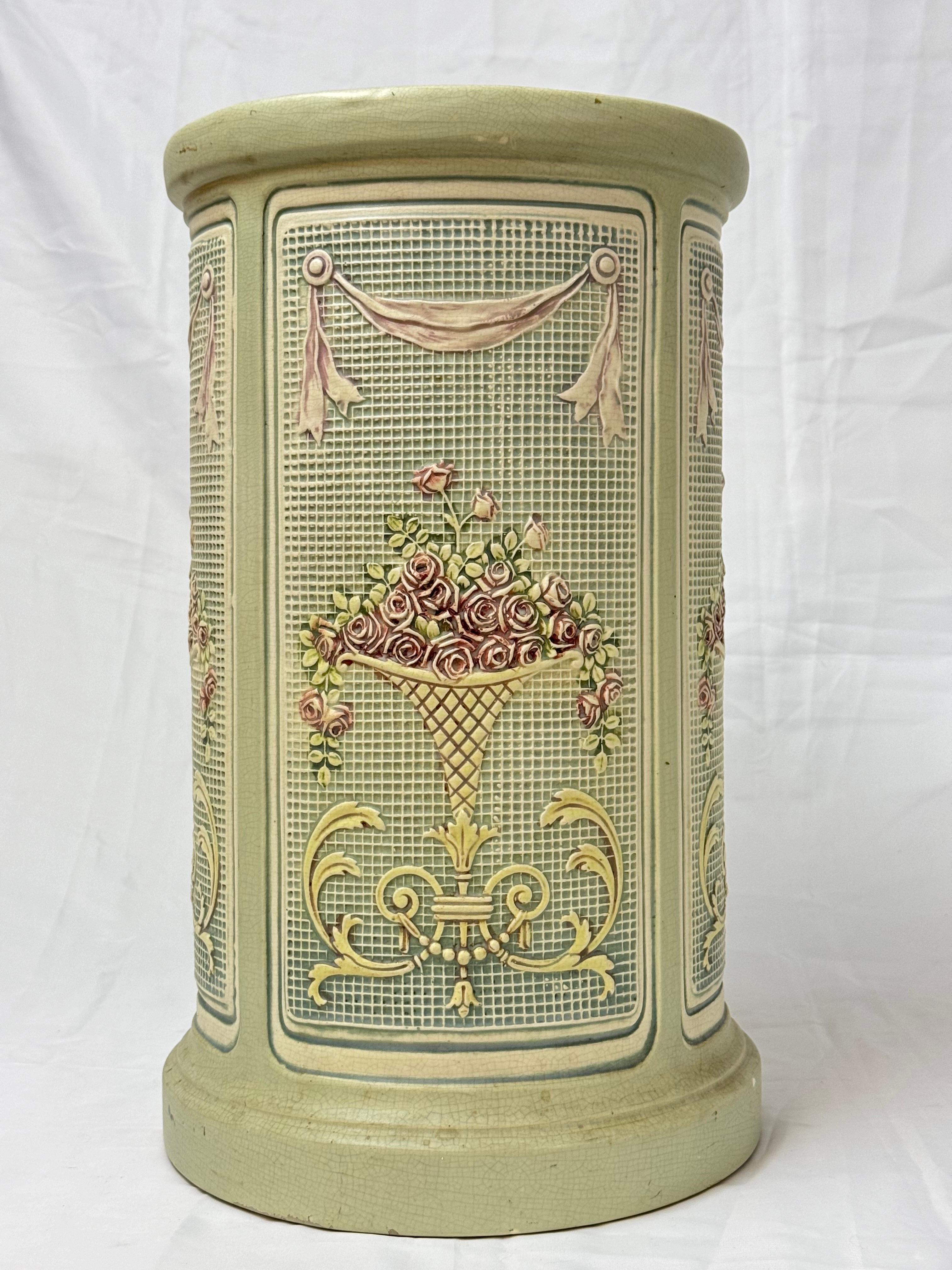 Rare and Collectible Weller Dupont Jardiniere Pedestalcirca 1930's . Romantic overflowing bouquet of roses with ribbons across a green and cream graph like background with a neoclassical design. Very hard to find. In very good condition. 
