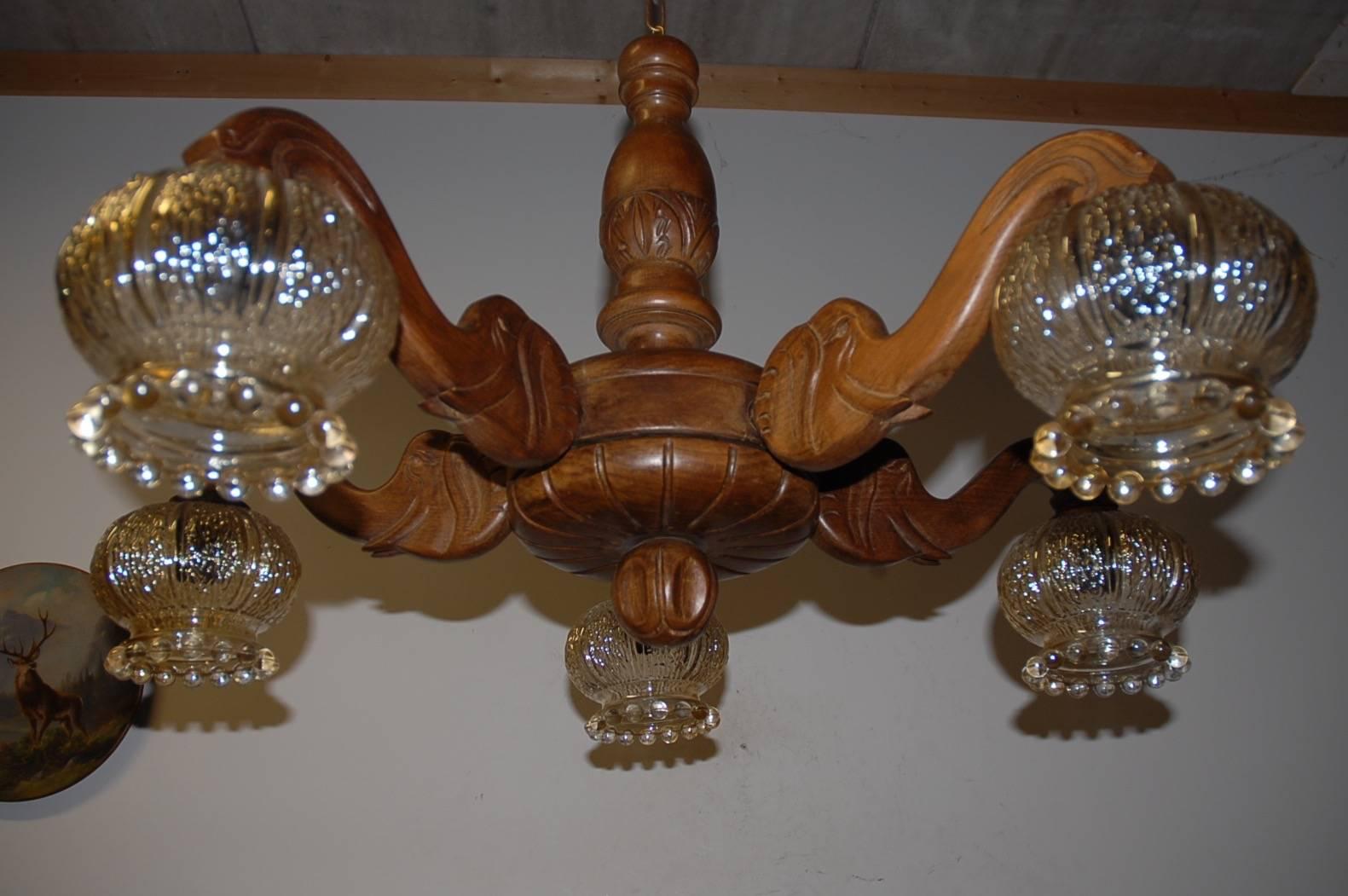 Stylish and highly decorative light fixture.

If you are an applied arts enthousiast in general and an elephant lover in particular then this one of a kind chandelier will really lift your spirit. This work of lighting art from the 1930s has five