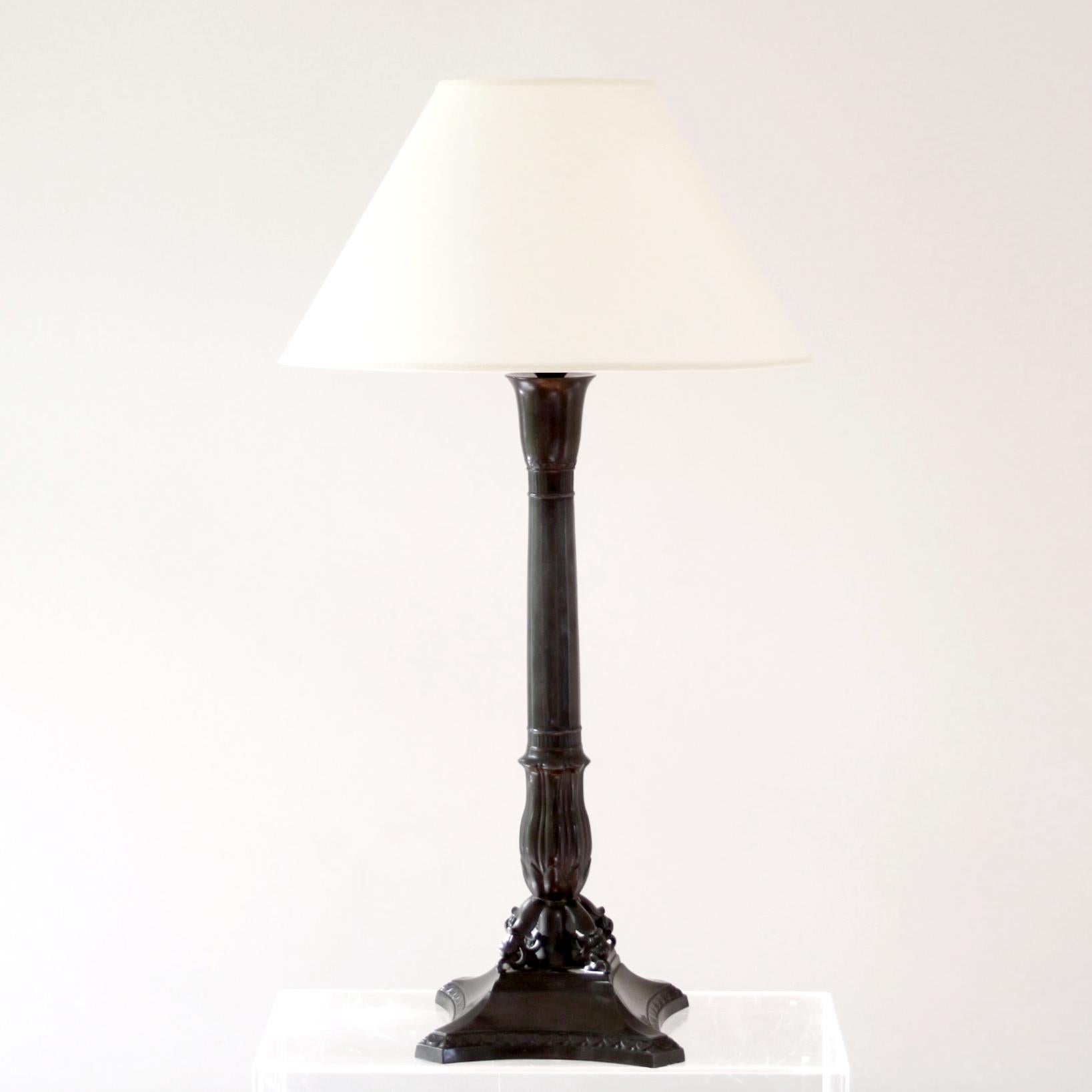 JUST ANDERSEN   -  DENMARK 1920s
 
Large and rare table lamp in patinated disko metal made by Danish designer and pioneer Just Andersen in 1920s. 

The lamp is beautifully decorated with ornaments. 

Early design, Dessin D8, stamped underneath.

The