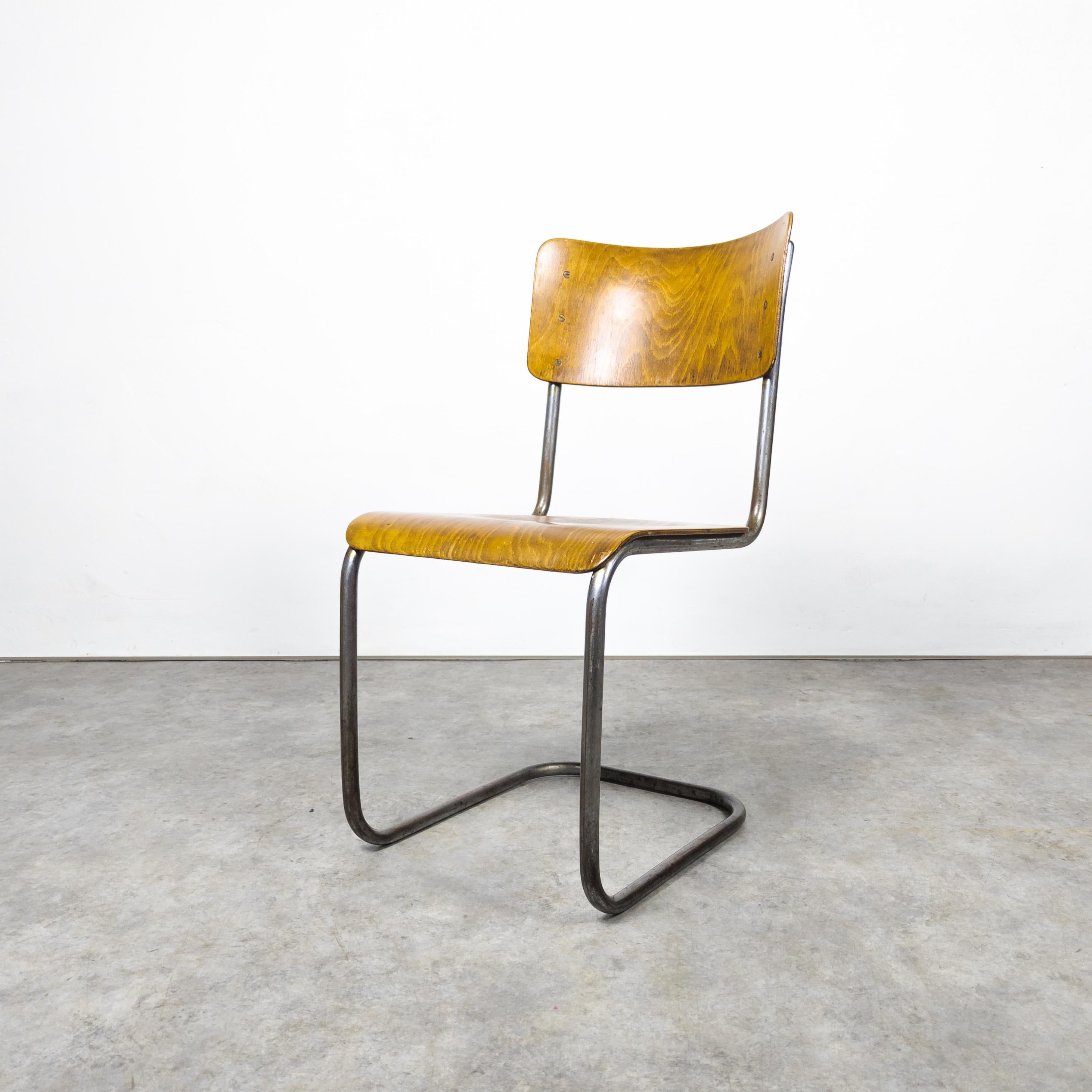 Rare early version of famous tubular steel chair manufactured by Vichr & co. , former Czechoslovakia in the 1930s. Bauhaus cantilever chair with a sturdy tubular steel frame, showcasing vintage charm. The steel elements exhibit distinct and lovely