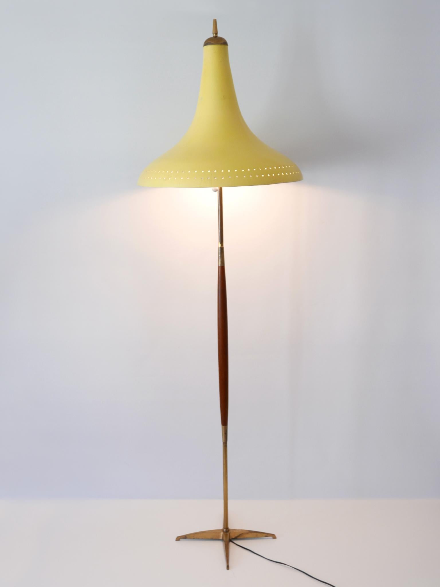 Absolutely rare, elegant and highly decorative Mid-Century Modern floor lamp or standing light. Designed and manufactured probably in Austria, 1960s.

Executed in teak, brass, metal and aluminium, the lamp needs 2 x E27 / E26 Edison screw fit bulbs,