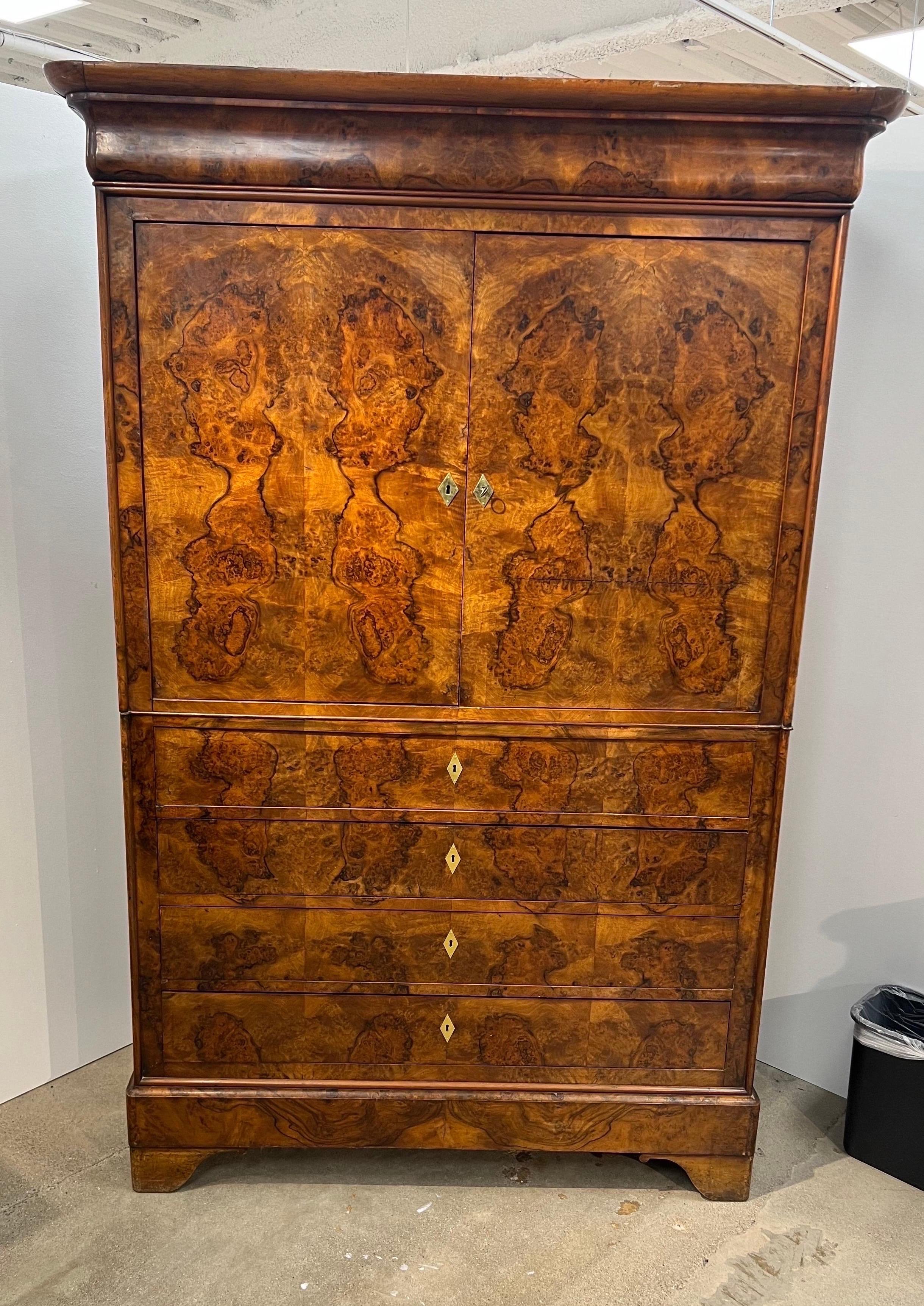 What a beauty! This fabulous and rare French 19th century burl walnut linen press is as easy on the eyes as it gets. It’s very uncommon to find linen presses made in France (the land of armoires). This oversized stunner shows the French attempt at