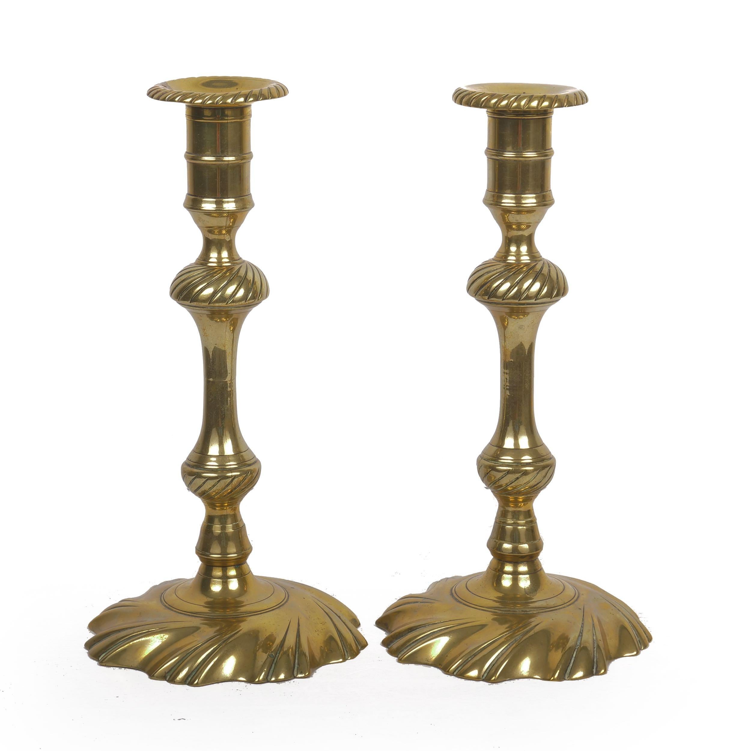 Rare pair of George III swirl-base brass candlesticks
England, circa 1760
Item # C104015 

A superb pair of George III candlesticks with removable candle wells and swollen swirl-knopped baluster stems over a fine swirl-base. For a similar