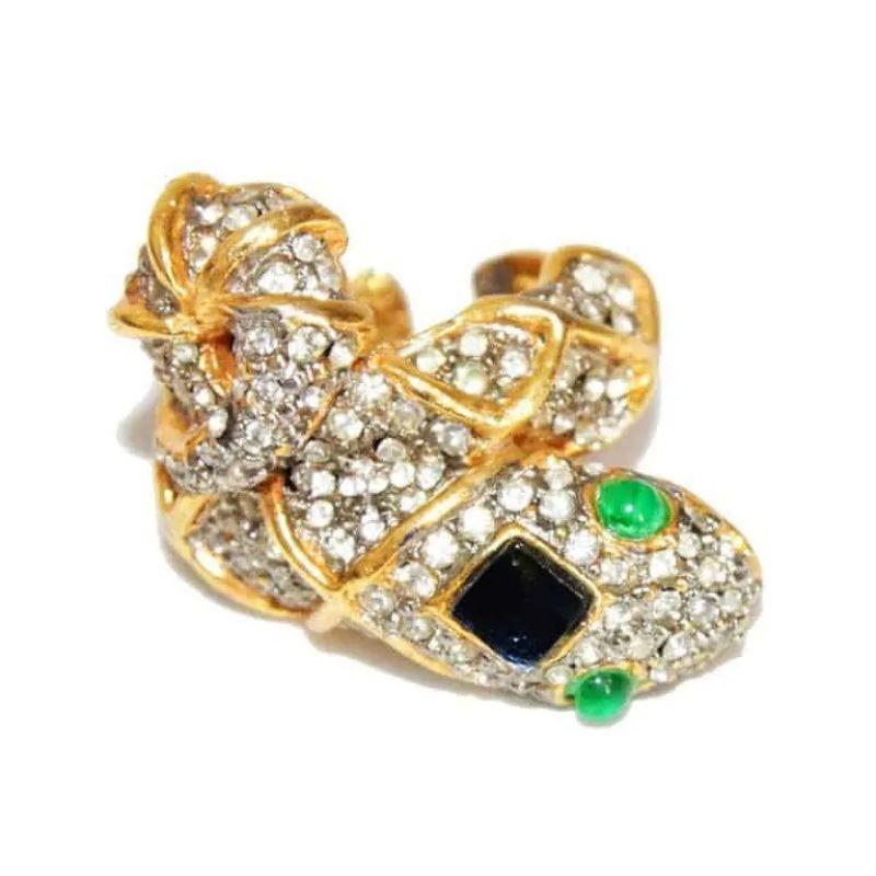Rare and Gorgeous vintage KJL snake crystal ring. Made of crystal stones, green & black glass cabochons. Gilt metal. 

Marked : KJL
Size : French size : 54 – US : 7
Condition: Excellent vintage condition (no stones missing)
