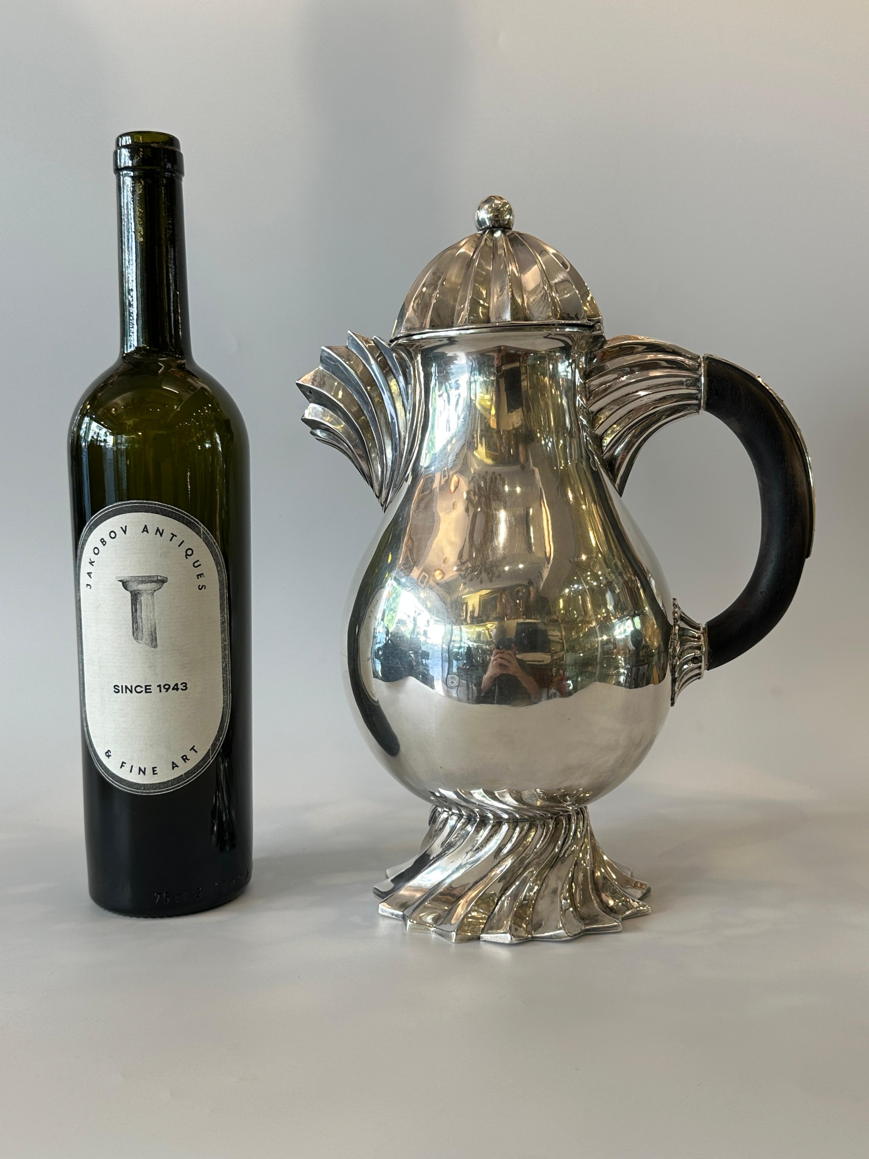 This wine jug in front of us  is all hand made by Bernhard Friedländer in the 1920s' in Düsseldorf,  Friedländers works from this era are very rare and mostly very small objects that were smuggled outside nazi Germany survived, this piece was