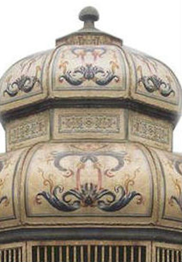 Italian Venetian style (20th Cent) octagonal shaped painted and decorated metal and wood bird cage with 8 upholstered seat and back cushions around base. (Franco Zefferelli Collection)
