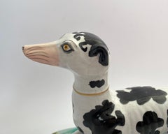 Rare and large Staffordshire ‘Disraeli Curl’ Greyhound, c. 1850.