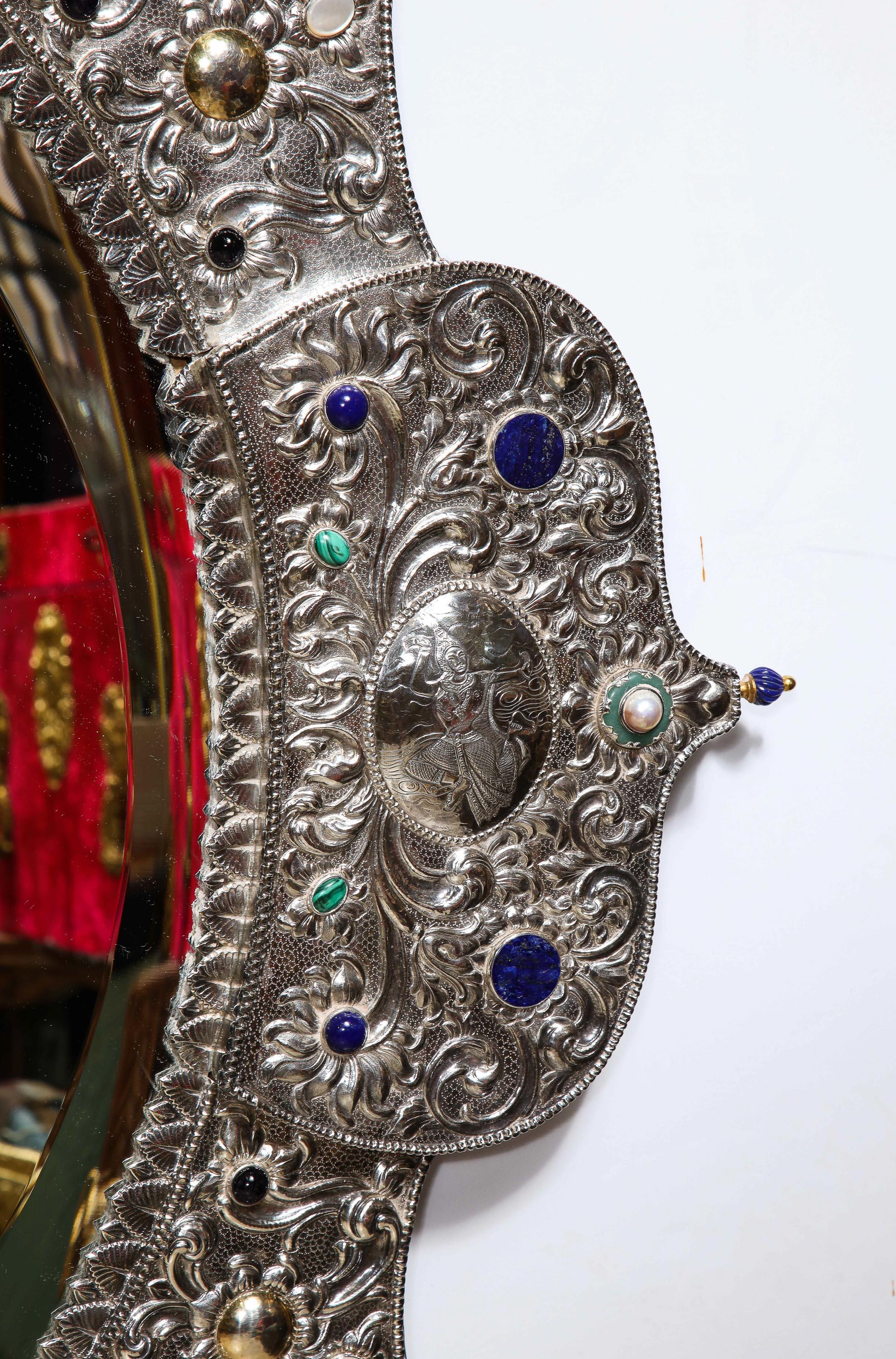 A rare and magnificent silver, gold & jeweled palace mirror, certainly made for an Indian Maharaja, circa 1900.

A special commission for an Indian palace from the late Victorian era, likely produced in Thailand. 

This palace size hand-hammered