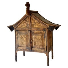 Rare and primitive Sumatran 2 Drawer Cabinet with Bird Carvings on all 4 Sides.