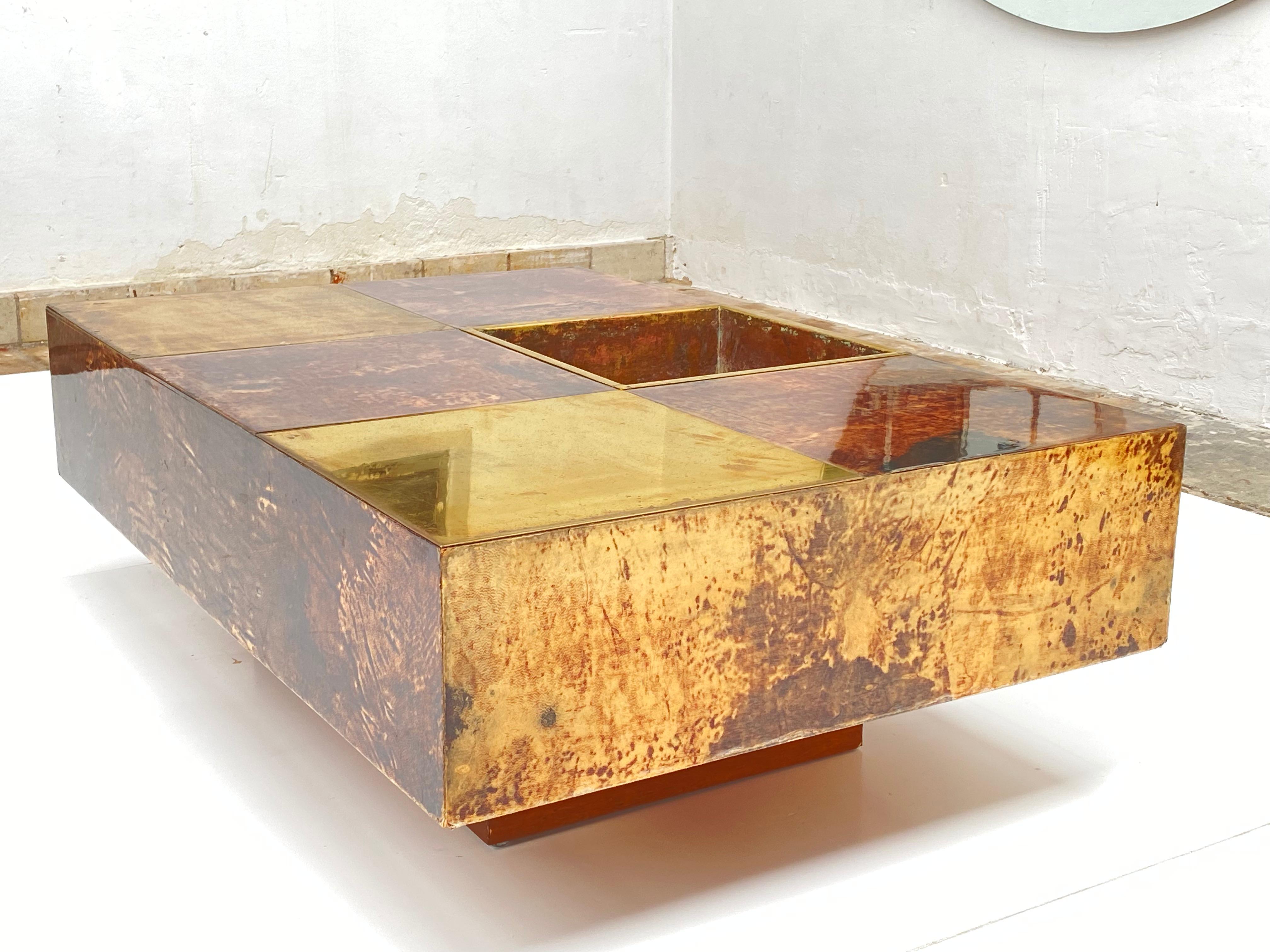 Rare and probably one of a kind planter coffee table in brass and brown lacquered goatskin by Milanese artist, Aldo Tura. Italy, circa 1960s. Exquisite, rare design.

Aldo Tura was born in 1909, and established a furniture production house in
