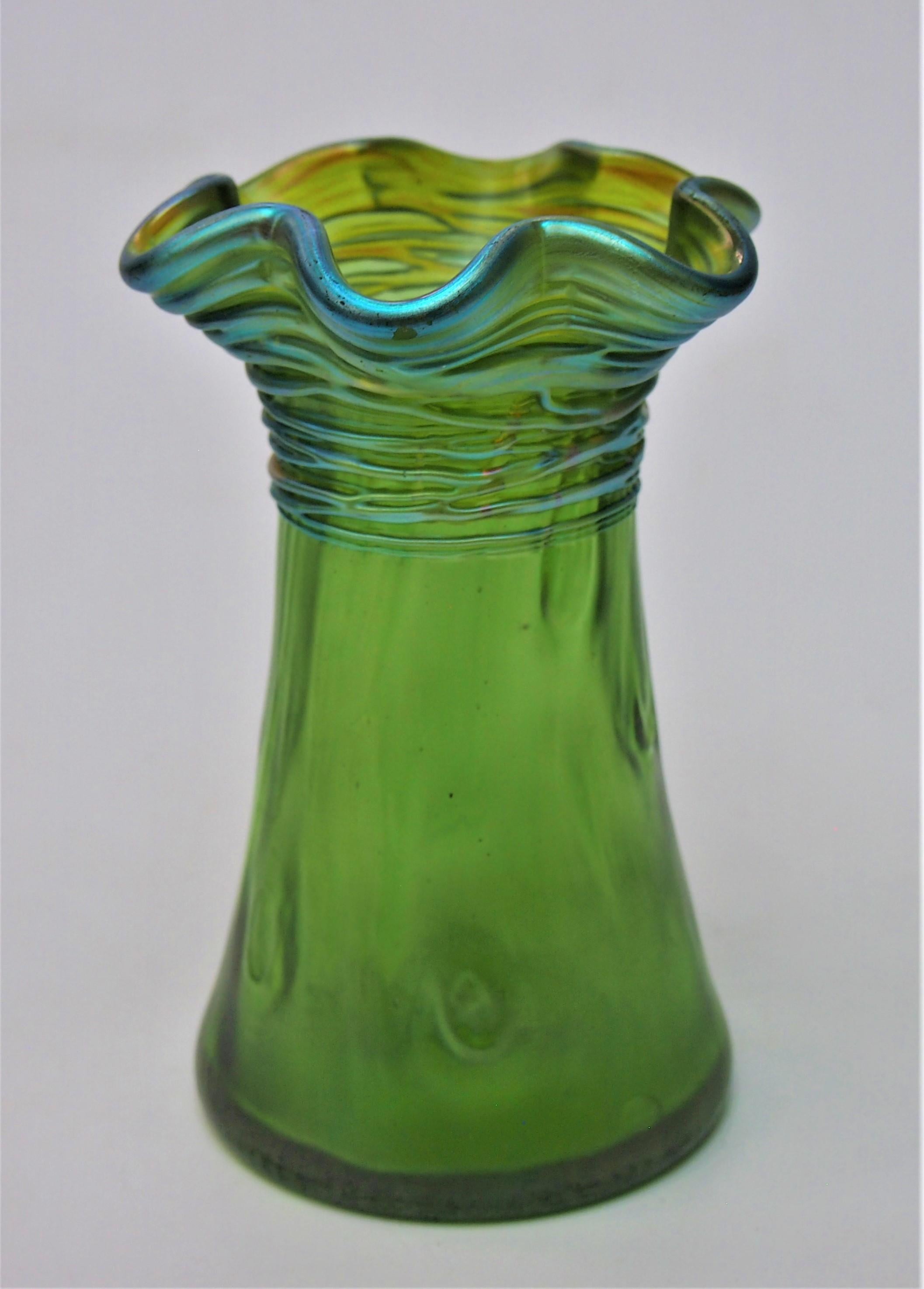 A fabulous Art Nouveau Loetz 'Crete' (green) Rusticana with Threads vase -Loetz. The Rusticana  décor (instantly recognised by the hand tooled wood knot - like body markings) is quite common, but the décor 'Rusticana with threads' which are hot
