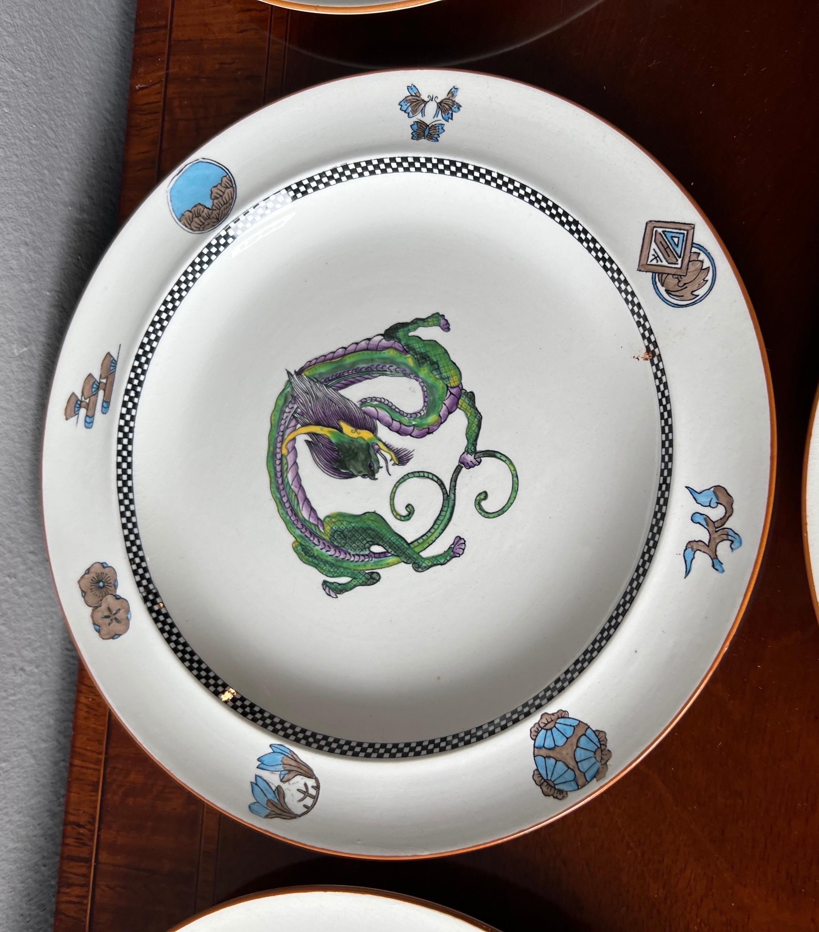 English Rare and Unusual Set of 12 Wedgwood Dragon Decorated Plates For Sale