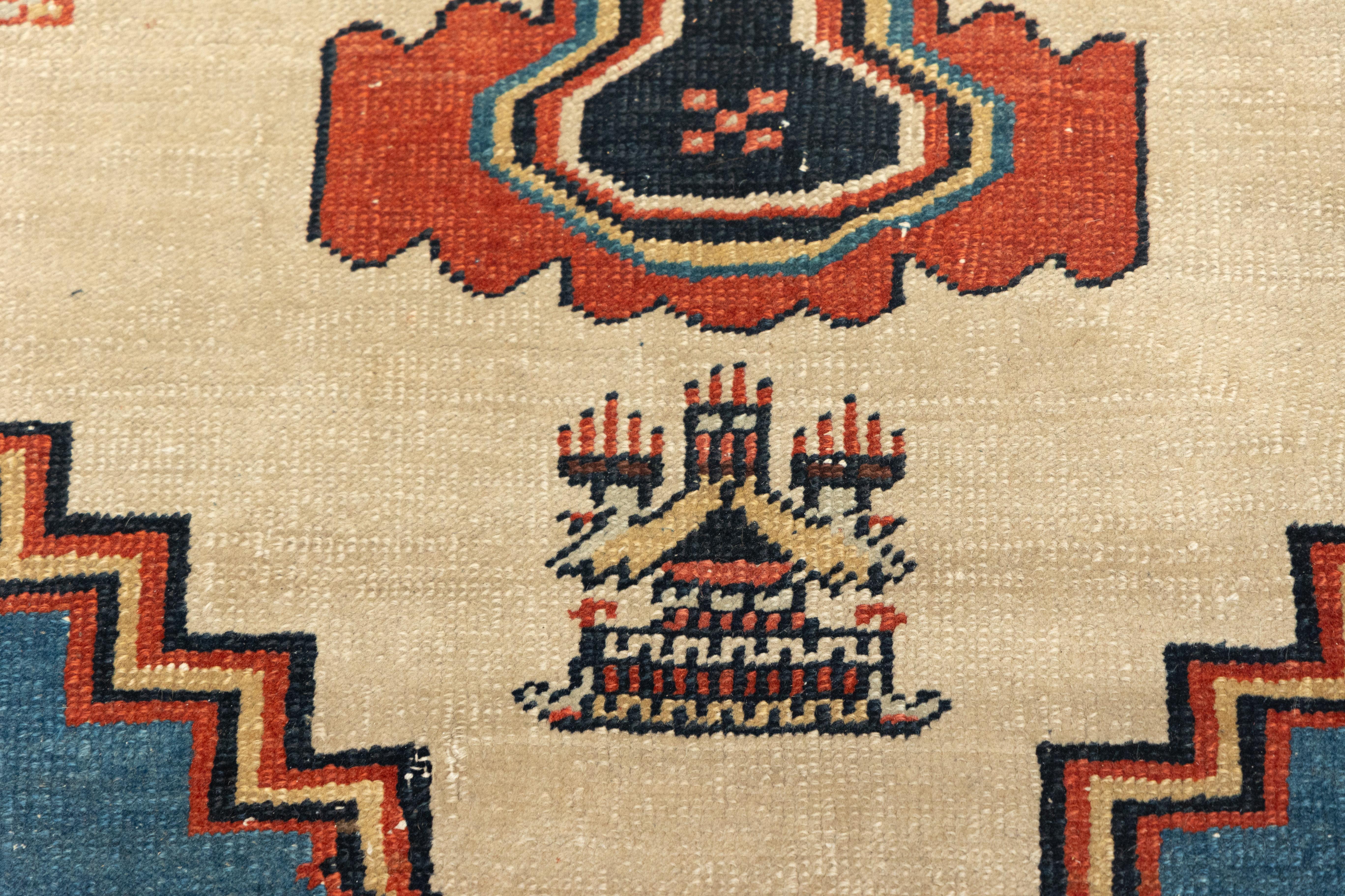 Antique and extremely enigmatic Bakshayesh rug featuring a striking geometric medallion design set within a vertically oriented rectangular field. The central medallion is a large tribal rust red with stepped edges and stylized botanical motifs,