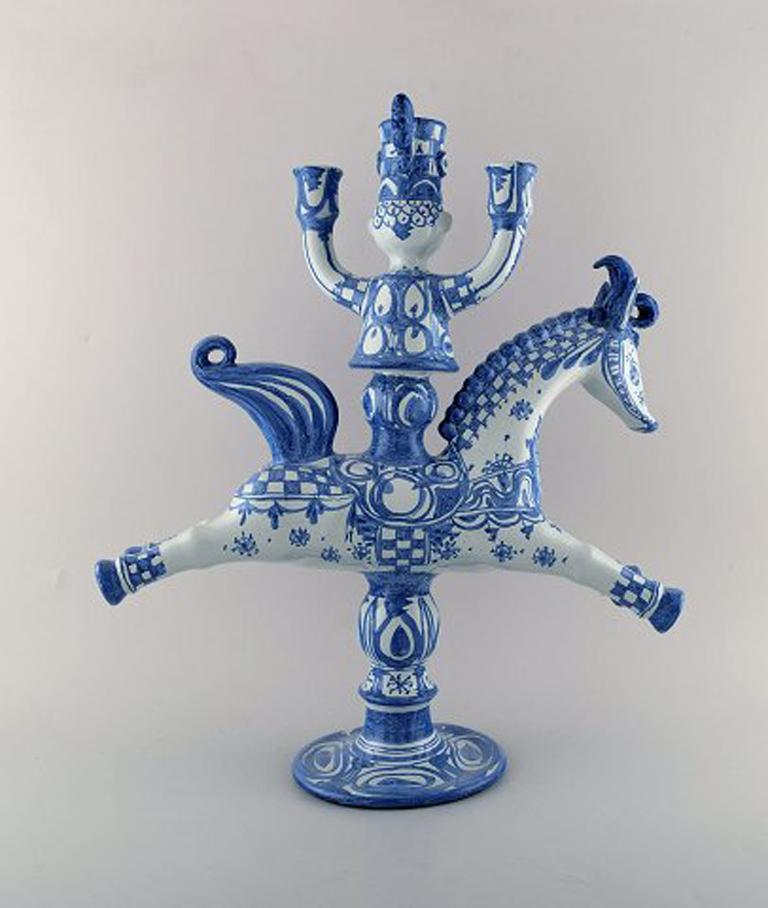 Rare and very large Wiinblad candlestick in the form of a rider with three candleholders. The candlestick is made of ceramic with blue decoration.
Stamped: L20 and monogram. Dated 73.
Measure: Height 48 cm, diameter 41 cm.
In perfect condition.