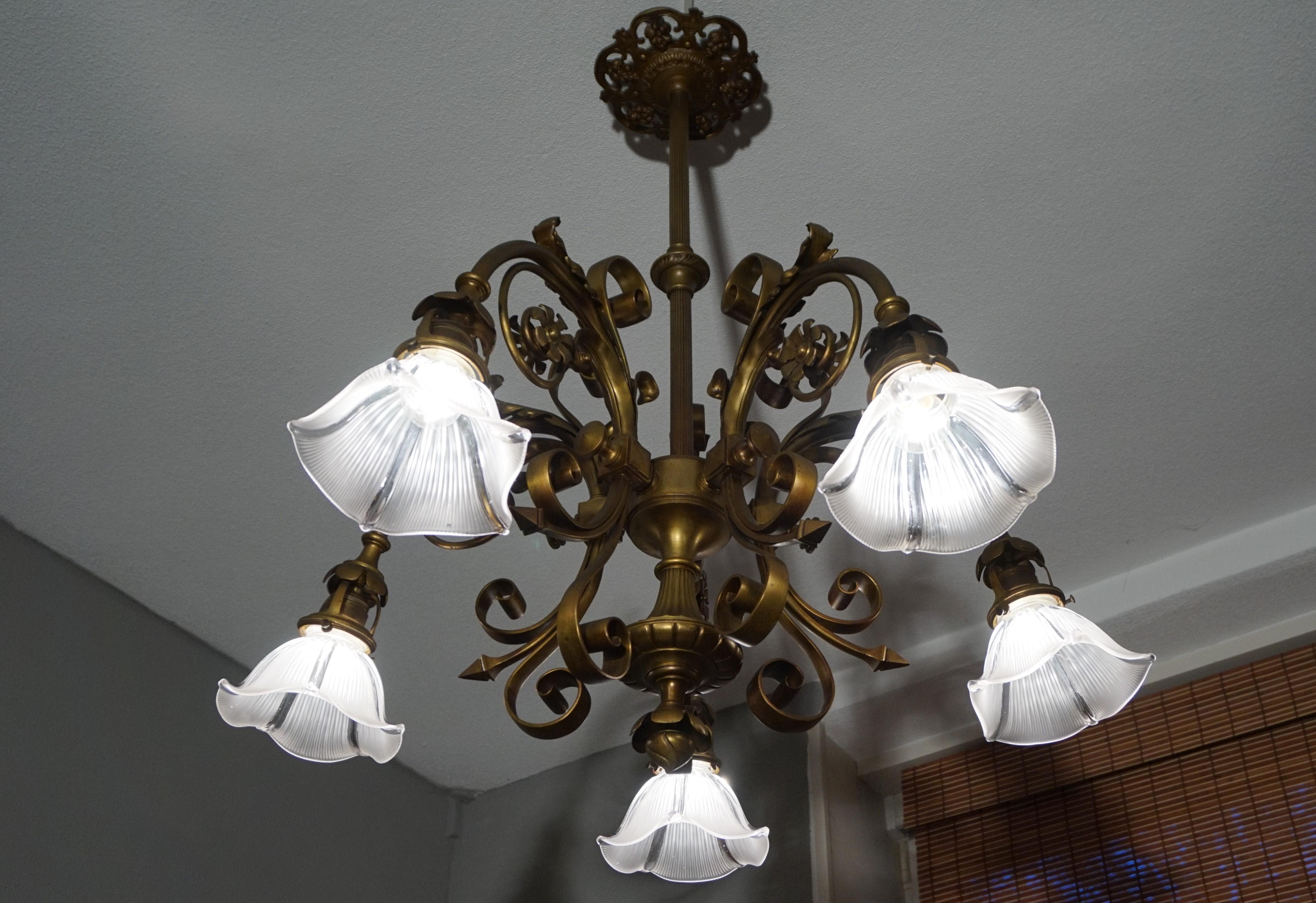 Arts and Crafts Holophane light fixture.

If you are looking for a striking and extraordinary light fixture to grace your living space then this antique, French work of lighting art could be the one for you. This handcrafted chandelier dates back to