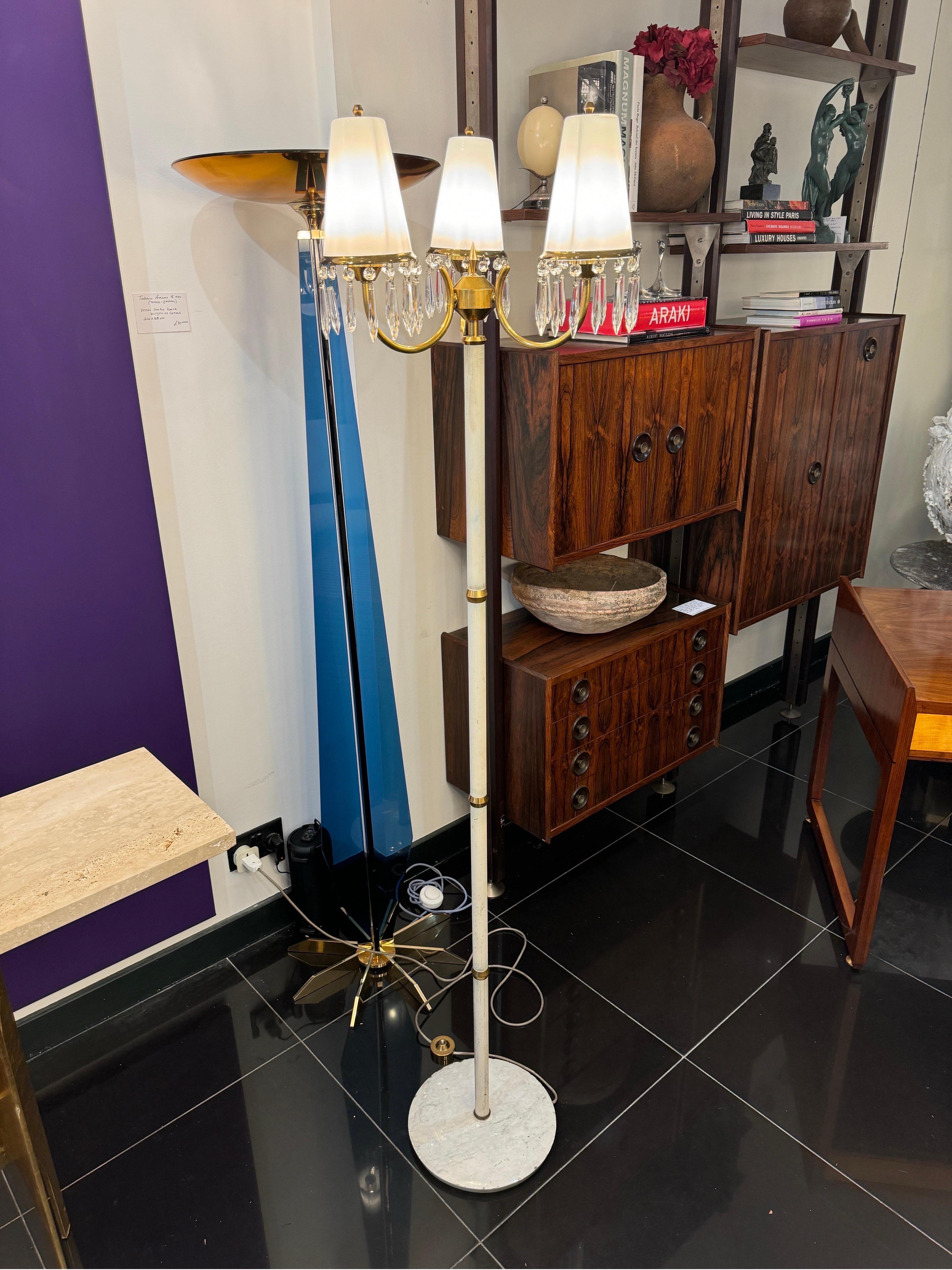 A rare floor lamp designed by Angelo Lelli for Arredoluce Monza featuring three opaline glass diffusers with crystal droplets, curved brass upper structure supported by enamelled white & brass rings column standing on a Carrara marble base . C1950s 