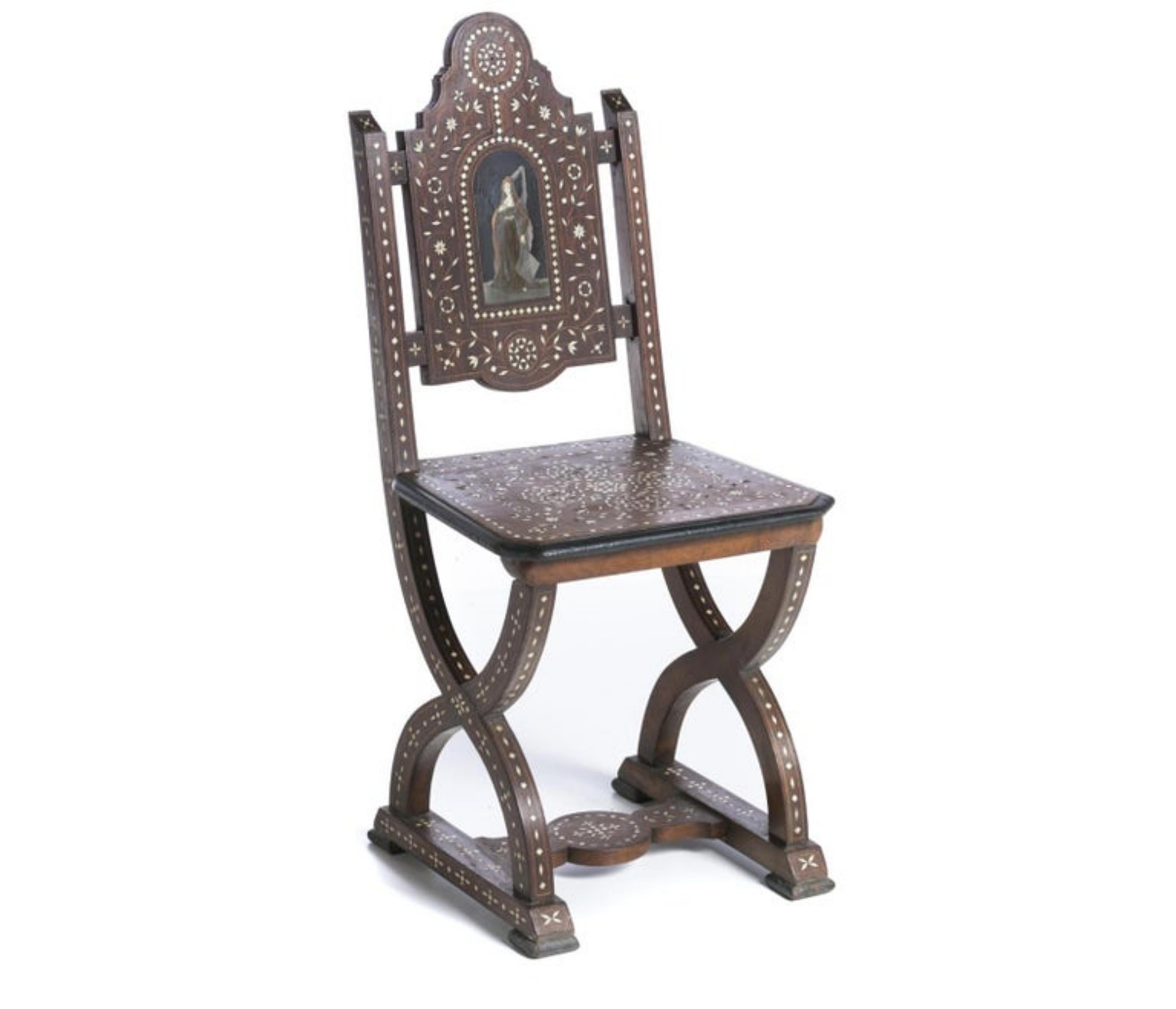 Rare chair

Anglo-Indian, 19th century.
In teak wood with Ivo... inlays, decorated with plant motifs, with a female figure in the centre.
Small flaws.
Dim.: 94.5 x 53.5 x 80 cm.
very good condition.