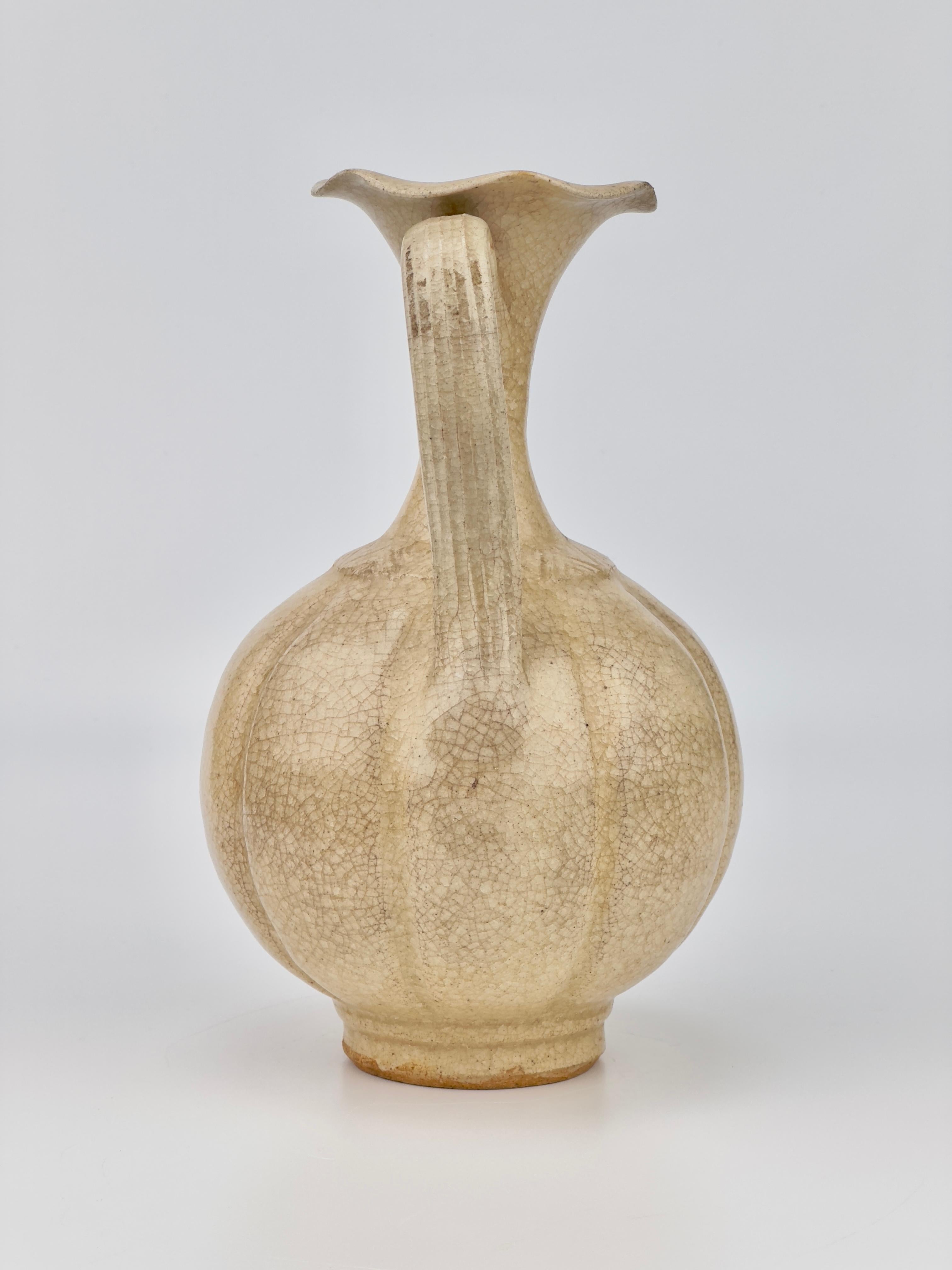 Famous annamese cream glazed ceramic ewer covered with a cream glaze. Traces of excavation are clearly visible in the glaze.


Dates : Presumably Ly Dynasty (11-13th century)
Region : Vietnam
Type : Ewer
Found/Acquired : Southeast Asia , South China