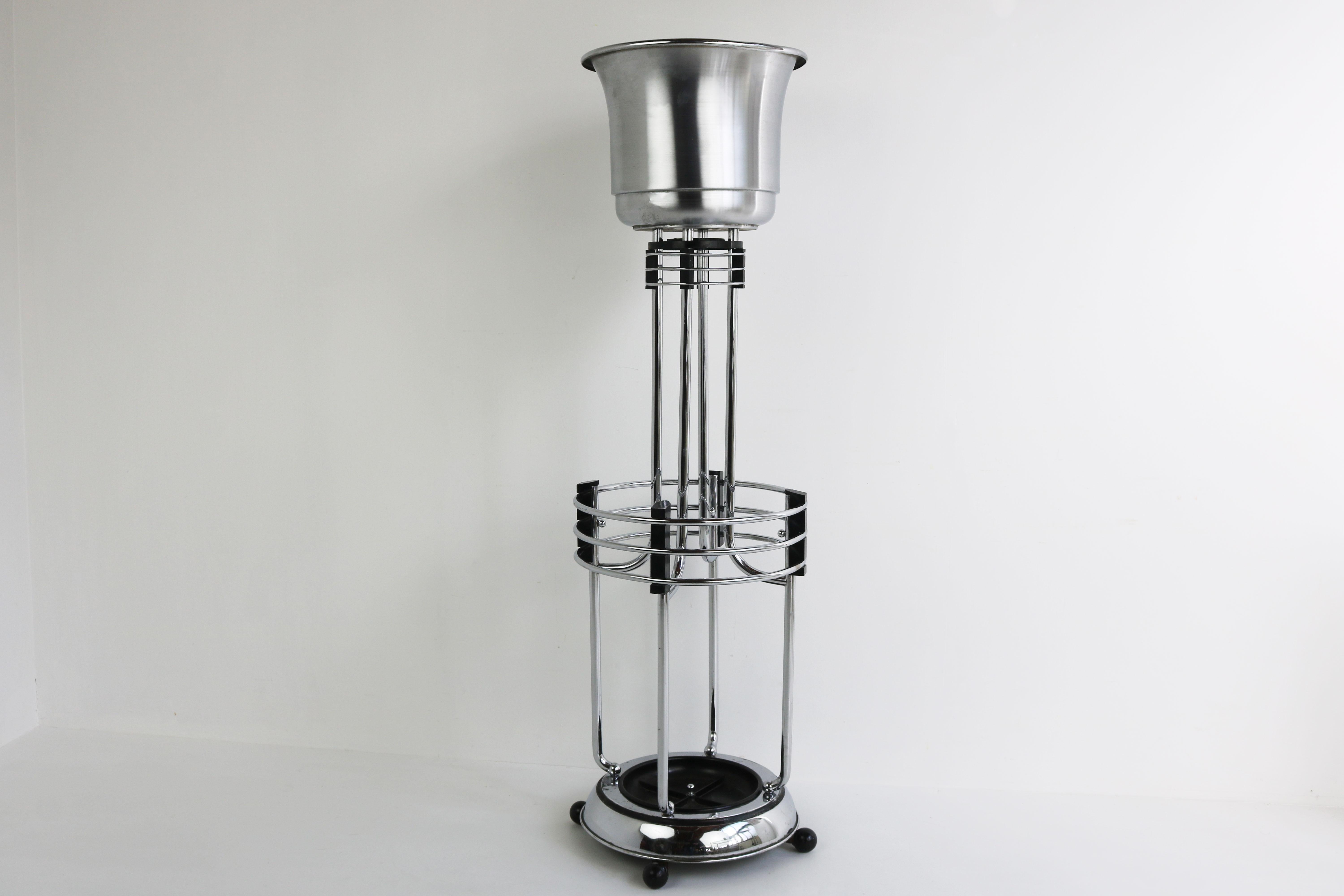 Stylish & rare! This exquisite streamlined Art Deco umbrella holder / plant stand designed by luxurious Belgian company ''Demeyere'' in 1930. (it can also be used as a Champagne bucket stand if desired) 
The umbrella stand is made out of Chrome &