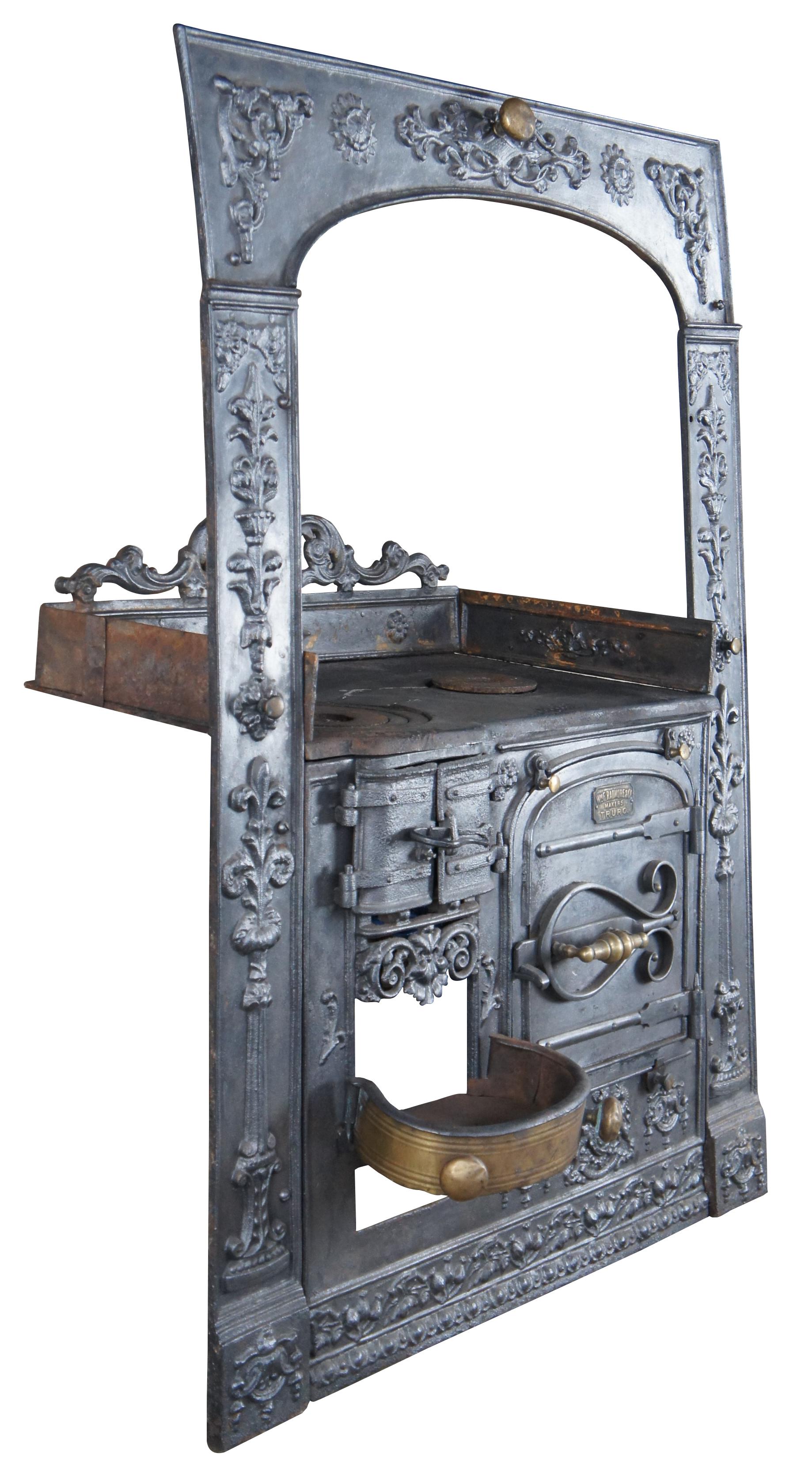 Rare Antique 1840s Cornish WmF Radmore & Co Makers Truro range cooker or fireplace stove featuring brass and cast iron construction

Blacksmiths of the time, manufacturing these ranges nicknamed them the 'Slab'. They featured heavy ornamentation