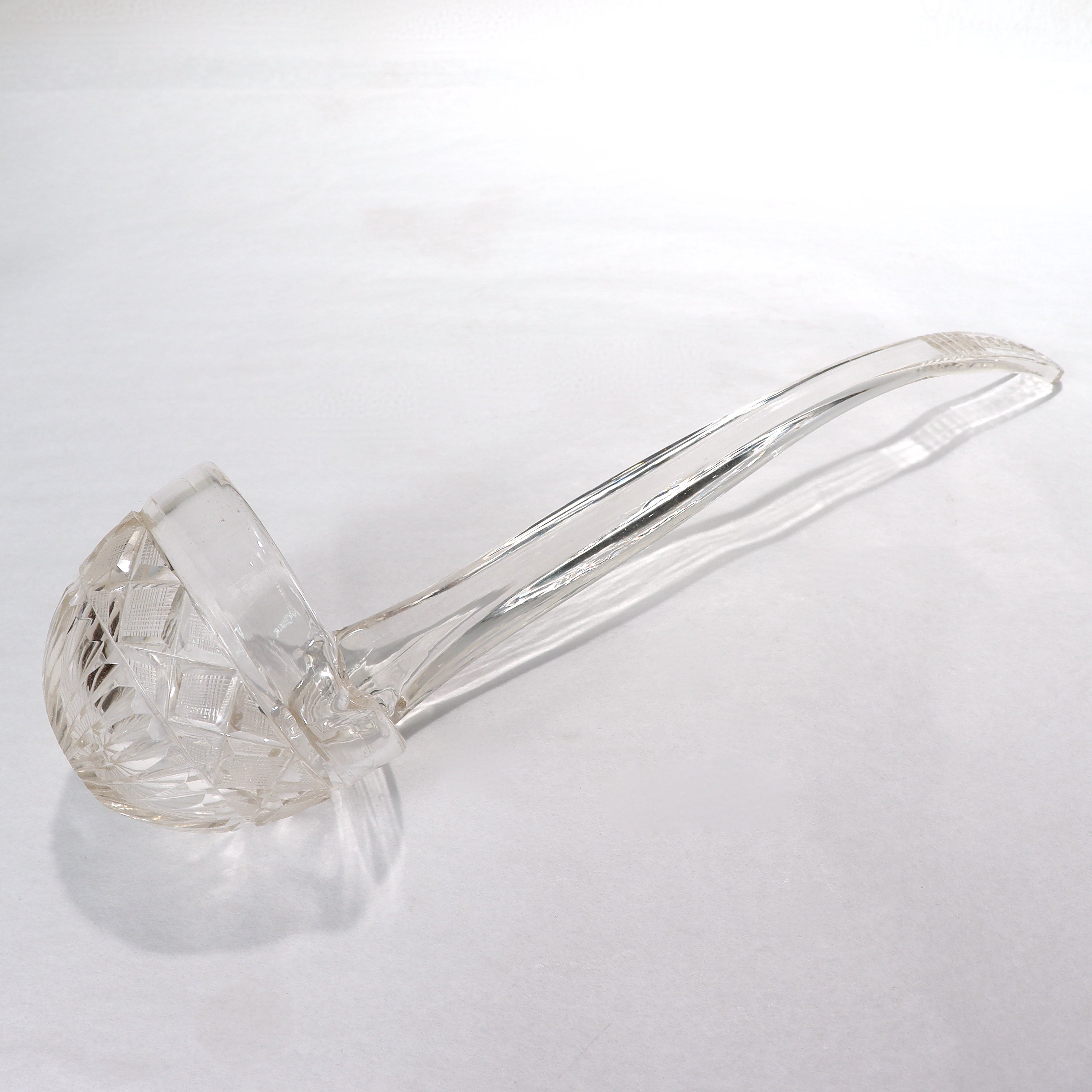 A fine and rare antique 19th century cut glass punch ladle.

With cut decoration to both bowl and handle.

(Possibly a Pittsburgh variant?)

Simply a rare form!

Date:
Early to Mid 19th Century

Overall Condition:
It is in overall good, as-pictured,