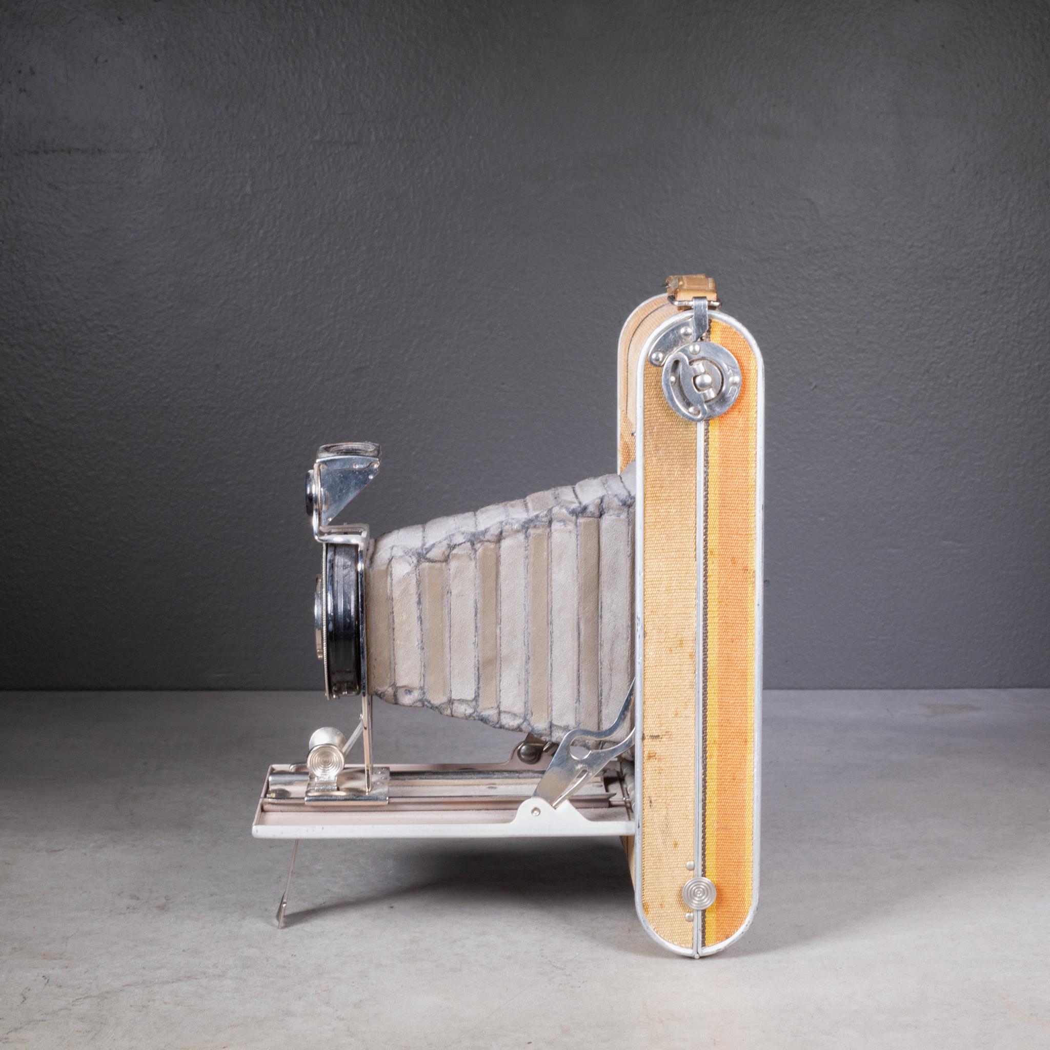 ABOUT  

An antique Readyset Traveler folding camera. The body of camera is covered in a luggage canvas with a a pop out view finder and it folds smoothly closed to 1.5 inches. This camera has retained its original finish and has the appropriate