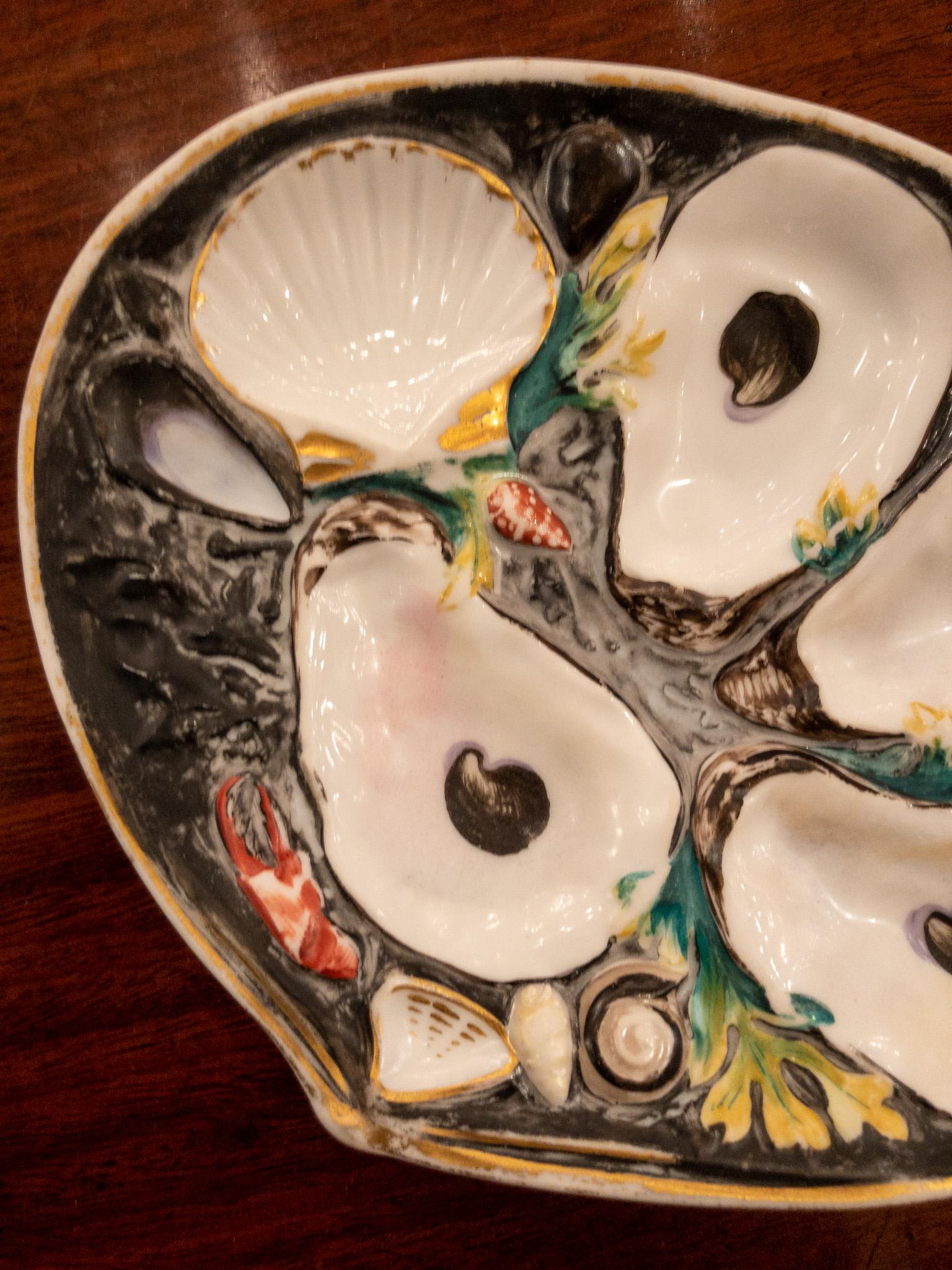 Rare antique American oyster plate signed Union Porcelain Works circa 1880, with hand painted black background.