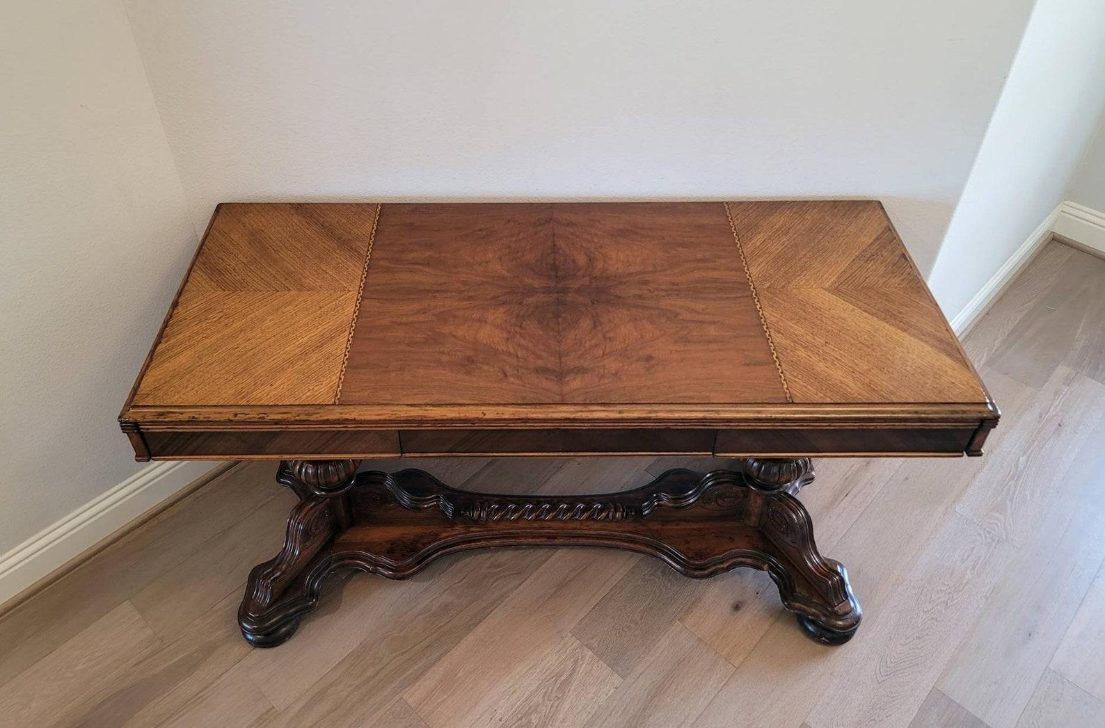 A scarce antique American Renaissance Revival style carved walnut extension table by Seng, Chicago, Illinois. circa 1920/1930

Born in the United States in the early 20th century, featuring a rare and unusual form and extension mechanism. Slightly