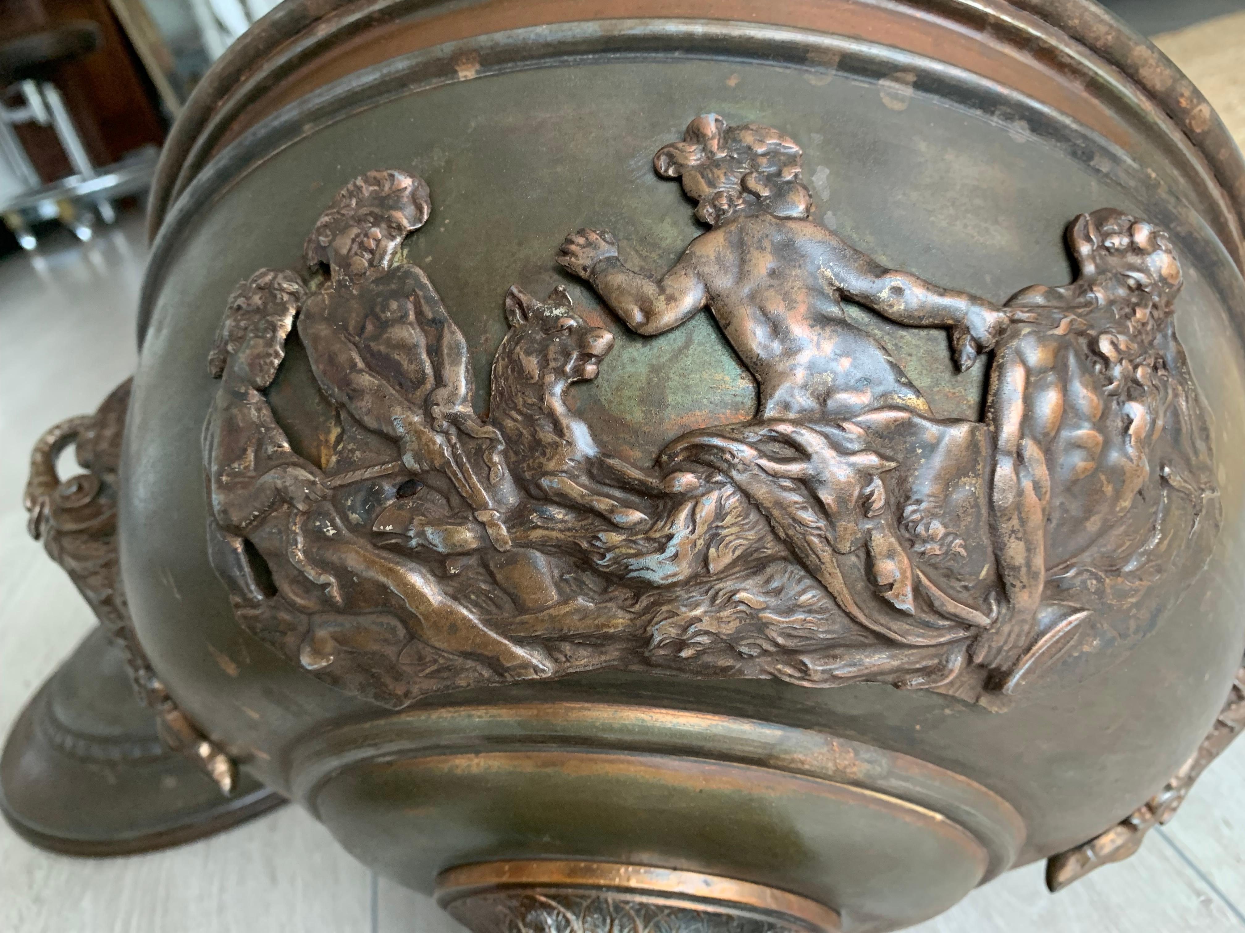 Decorative ash or coal bucket with fauns, putti and various mythological creatures.

If you are a collector of rare and sculptural antiques then this possibly unique bucket could be gracing your fireplace soon. The artisan metal worker who