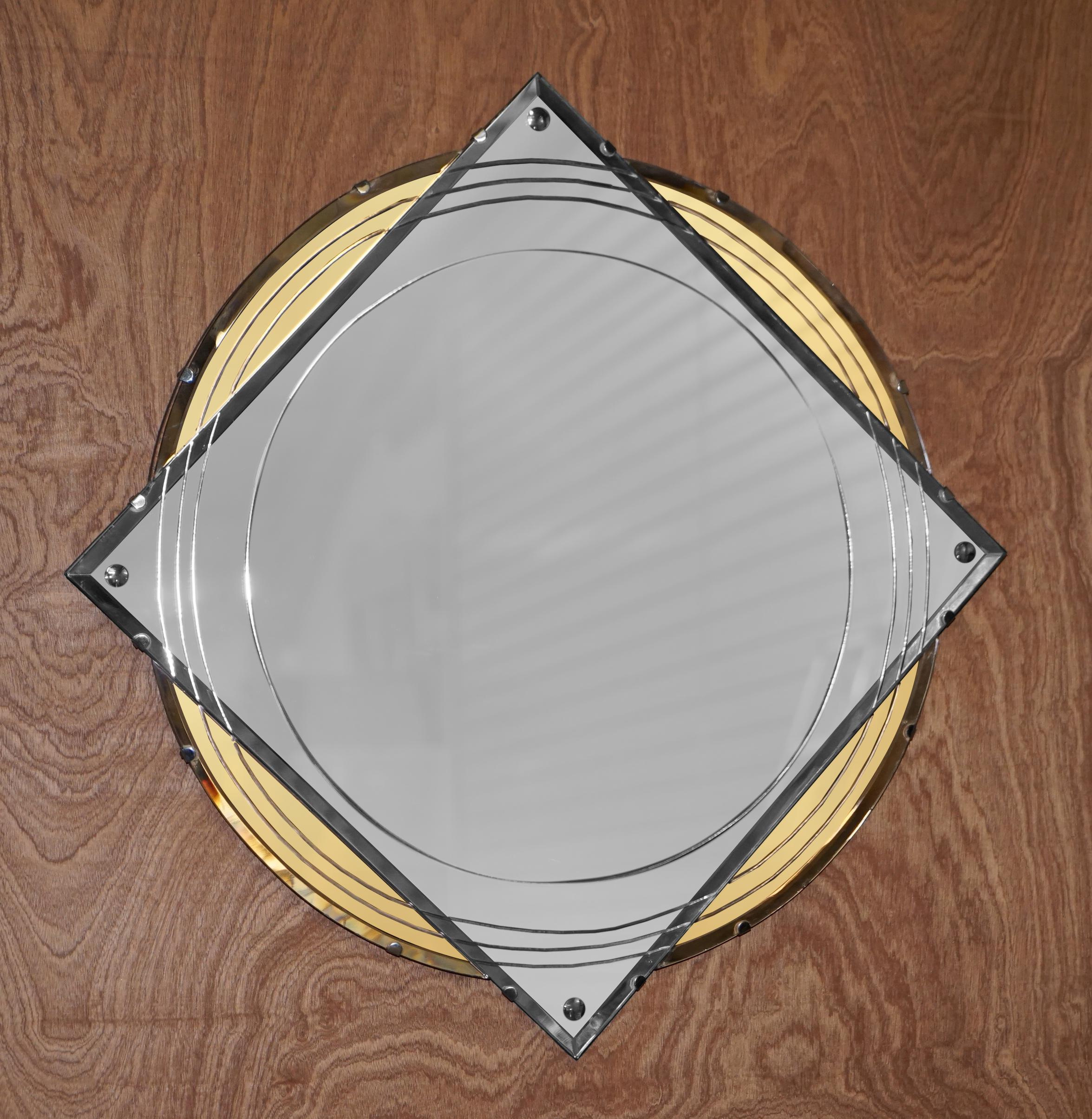 We are delighted to offer for sale absolutely sublime Amber glass Art Deco wall mirror with Georgian Irish style detailing

A very decorative piece, the circle sections are amber glass which looks gold in the pictures but in the normal light its