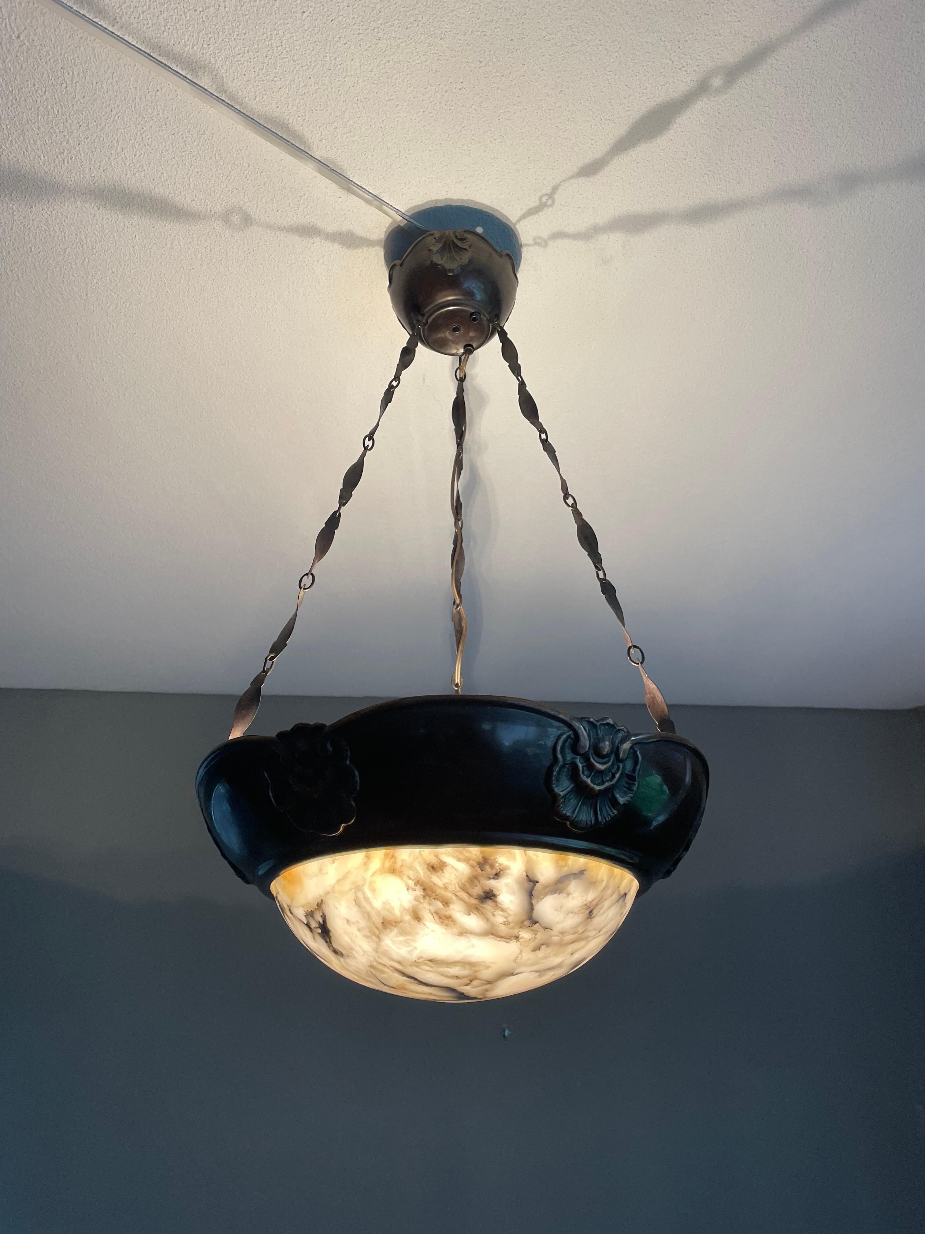 Copper and alabaster Arts & Crafts chandelier with original twirled copper chain & canopy.

With early 20th century lighting being one of our specialities, finding this rare and extraordinary pendant more than made our day. The combination of the