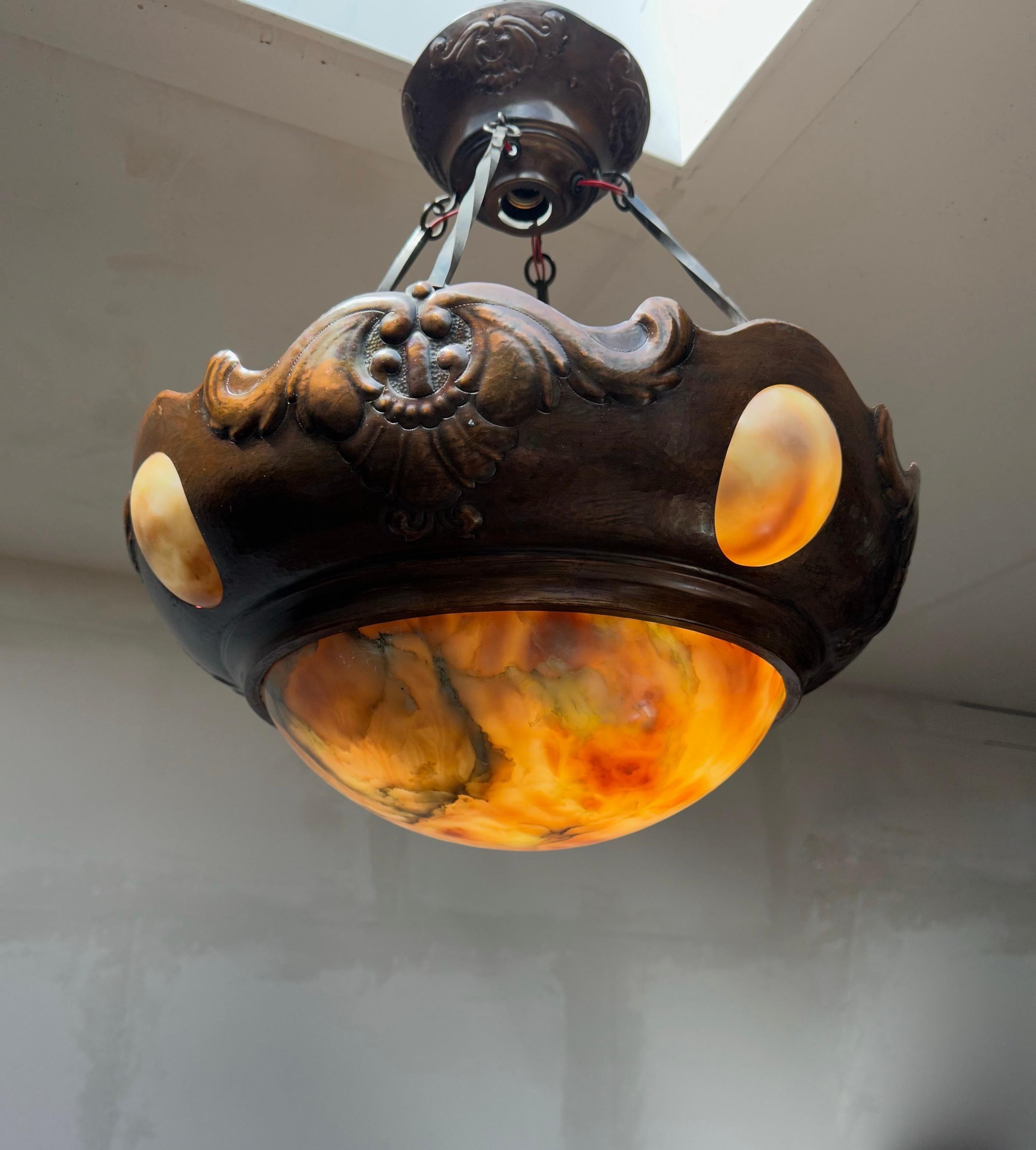 Copper and alabaster Arts & Crafts chandelier with original twirled copper 'chain' & original canopy.

With early 20th century lighting being one of our specialities, finding this rare and extraordinary pendant more than made our day. The