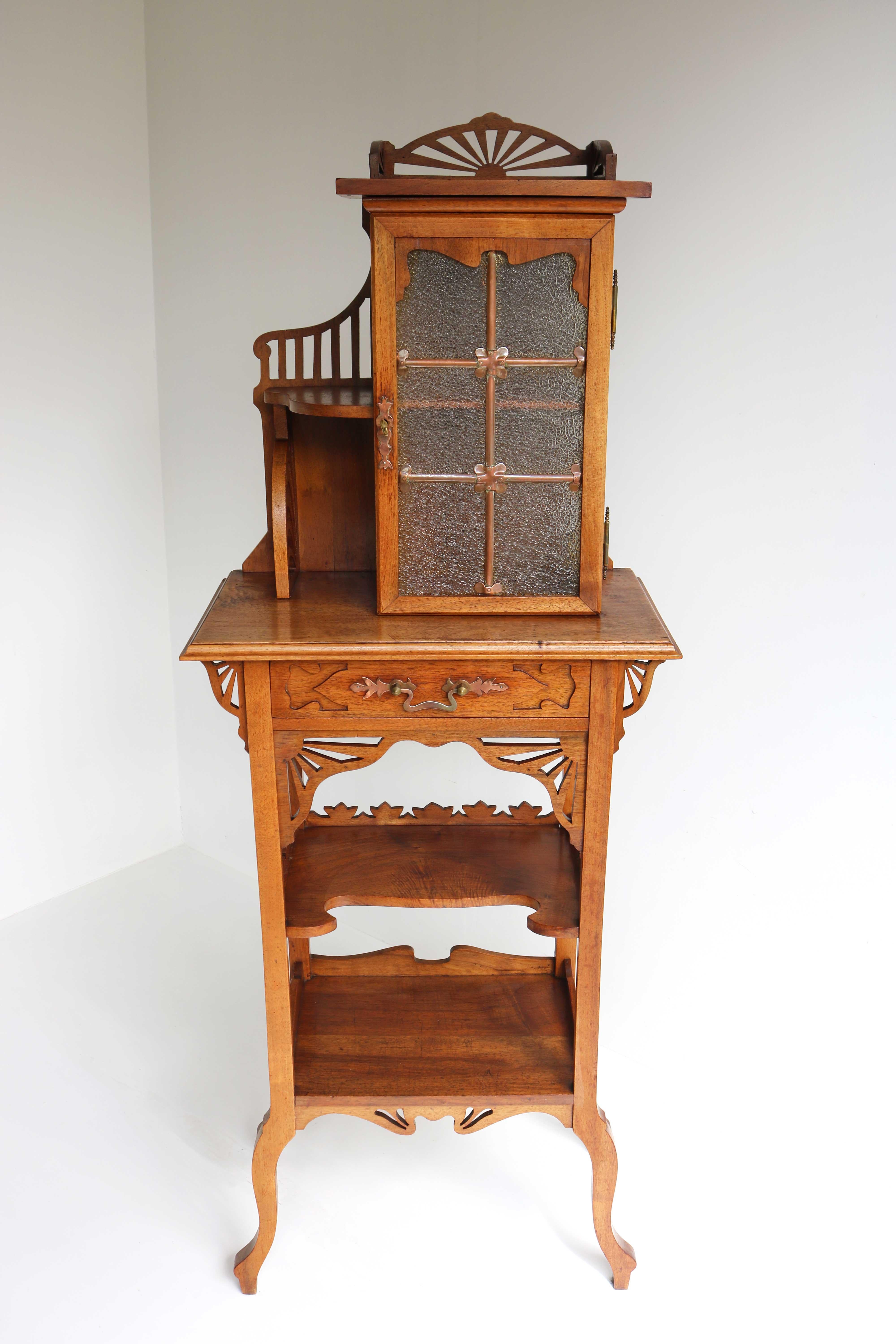 This wonderful lovely piece of furniture is a true eye catcher in an Arts & Crafts or Art Nouveau home! 
Unusual rare small cabinet c.1900- 1910. Rare because of its size and quality!
Versatile furniture that can be used in different areas of your