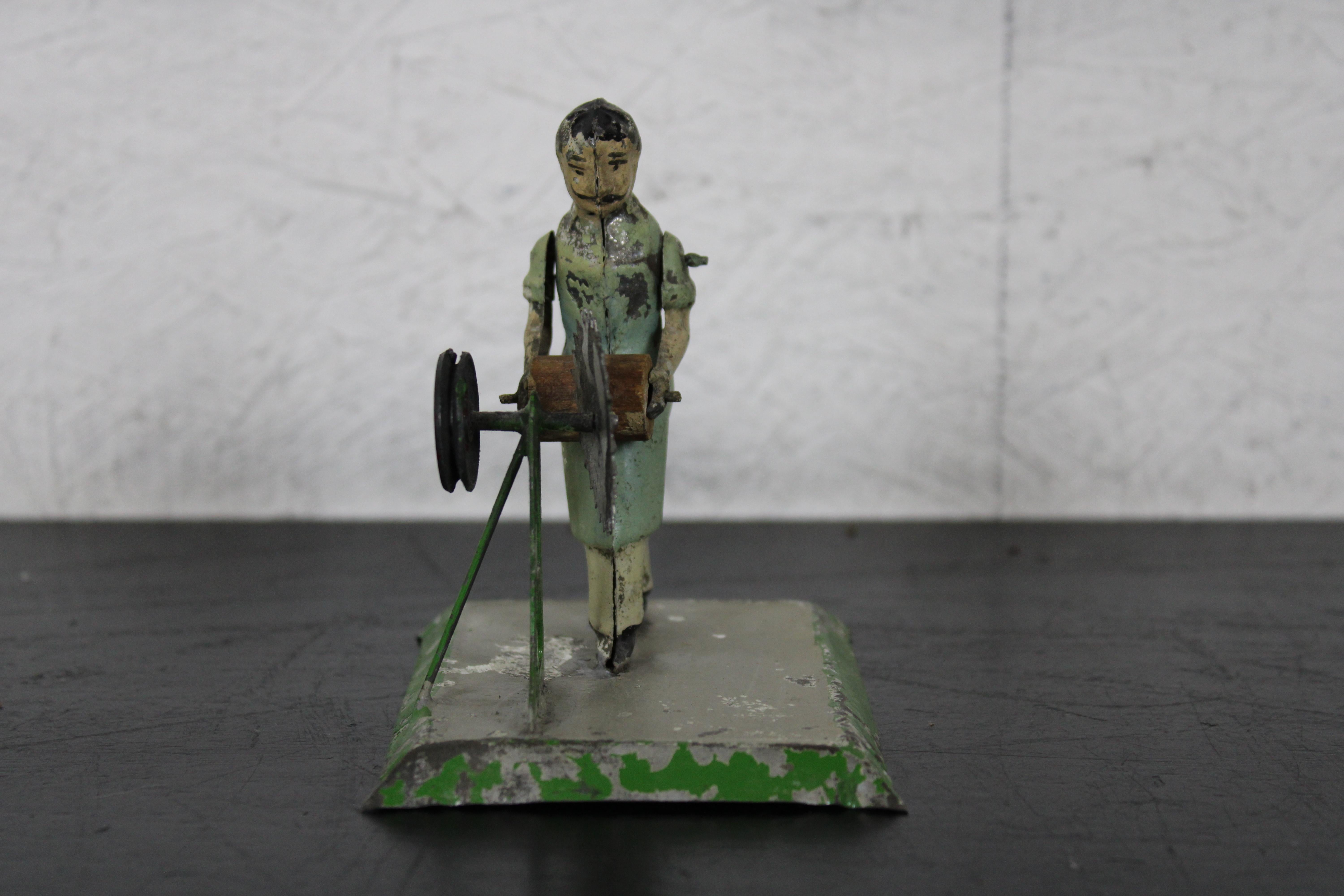 20th Century Rare Antique Bing German Lacquered Tin Figure Woodcutter Saw Mechanical Toy