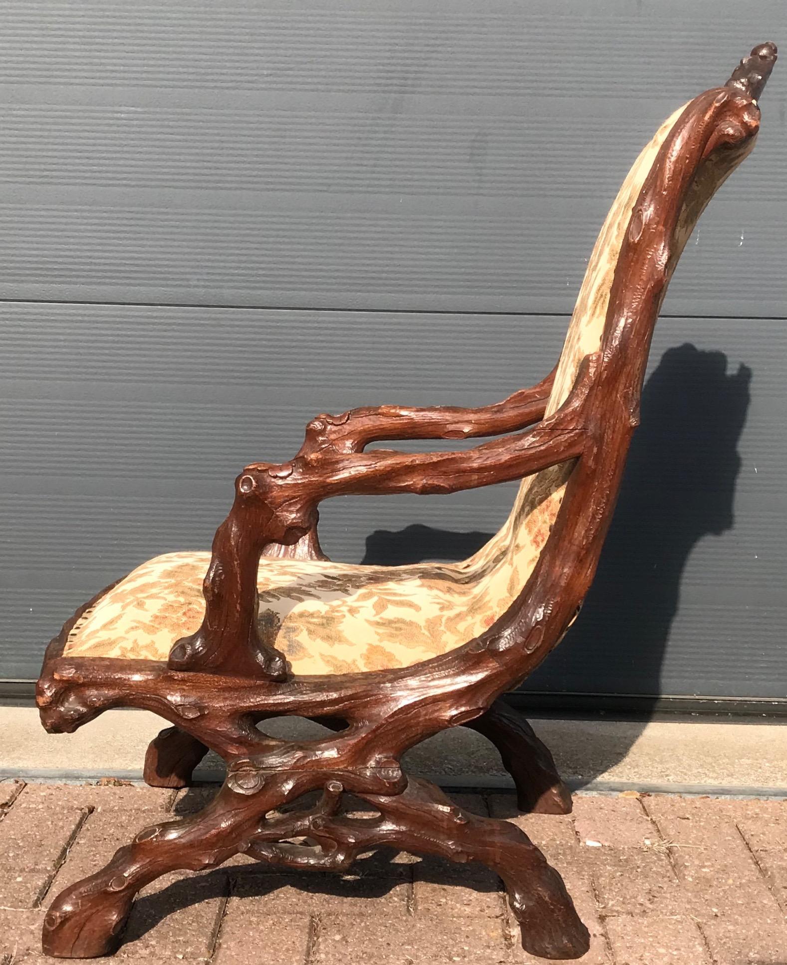 Unique and impressive relax chair from circa 1870. 

This unique chair is as stable as the day it was made and the woodwork is in good to excellent condition also. The solid handcrafted nutwood frame comes with a variety of good quality carved,